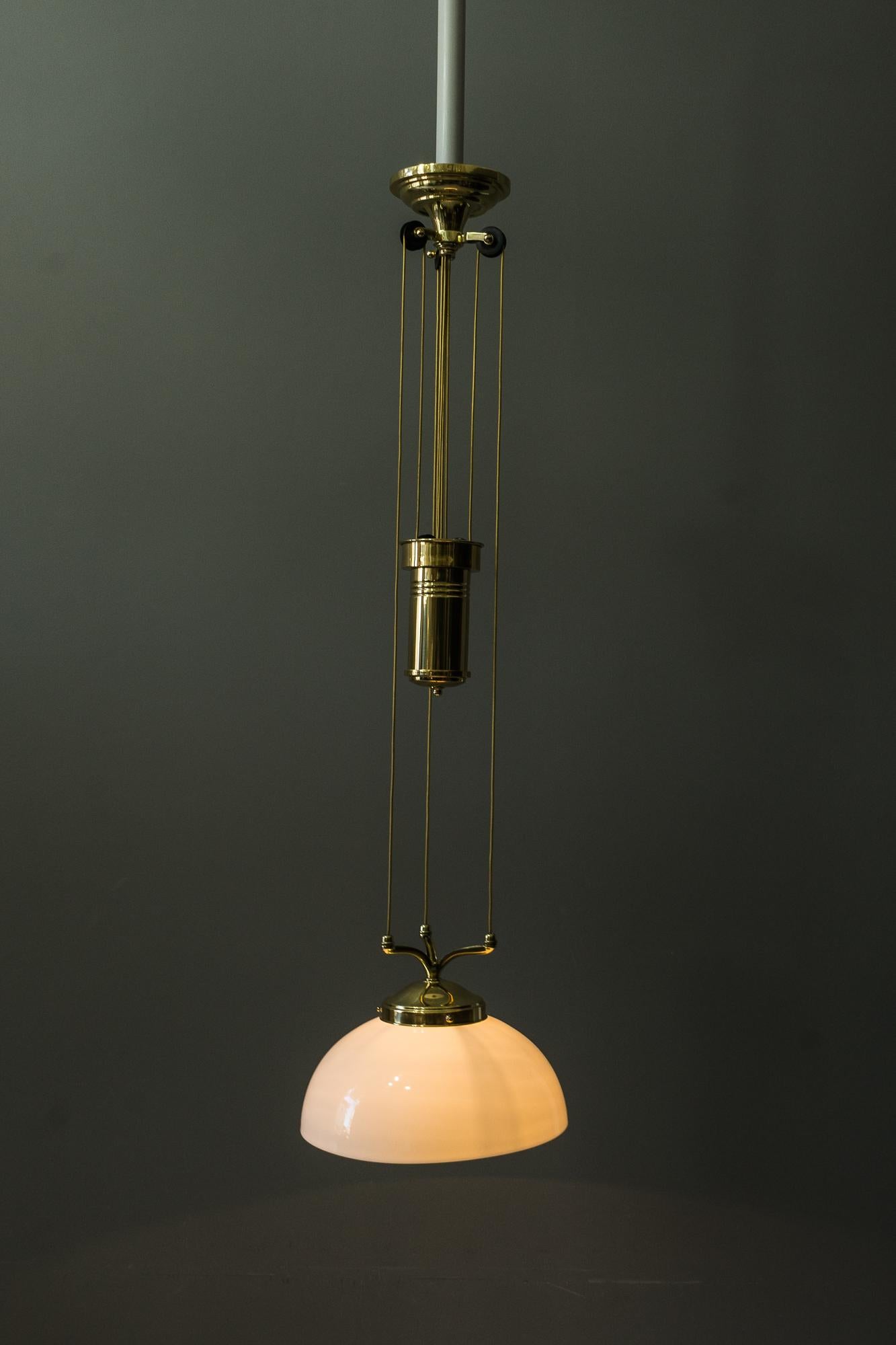 Adjustable Jugendstil chandelier with white opal glass, circa 1907
Polished and stove enameled
Measures: The high is adjustable from 90cm-180cm
Wide is 31cm
New wiring.