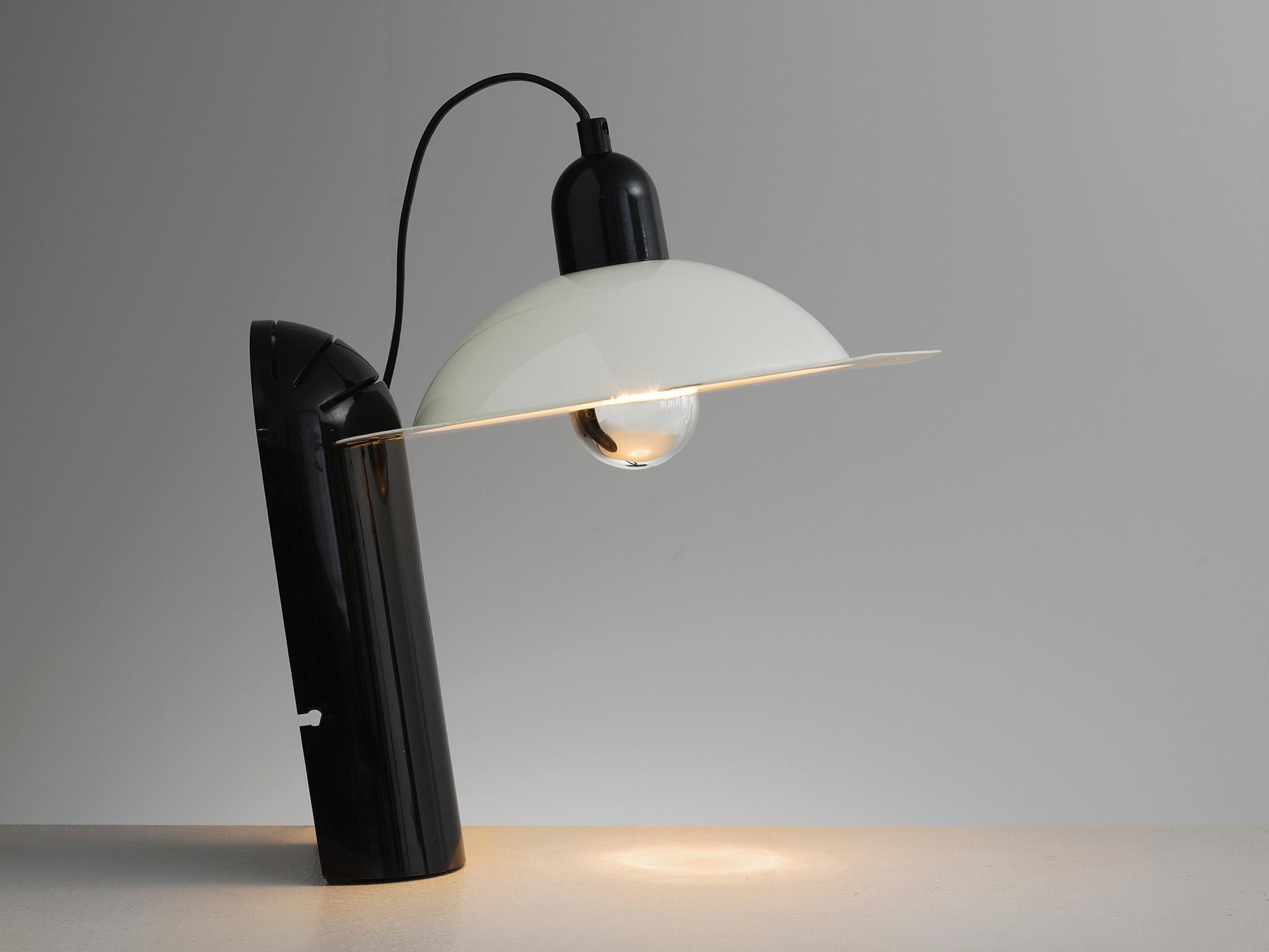 Jonathan de Pas, Donato d'Urbino, and Paolo Lomazzi for Stilnovo, table lamp 'Lampiatta', metal, plastic, Italy, 1971

This postmodern lamp consists out of a white lamp shade and a black base out of plastic. Besides the form the lacquered metal and