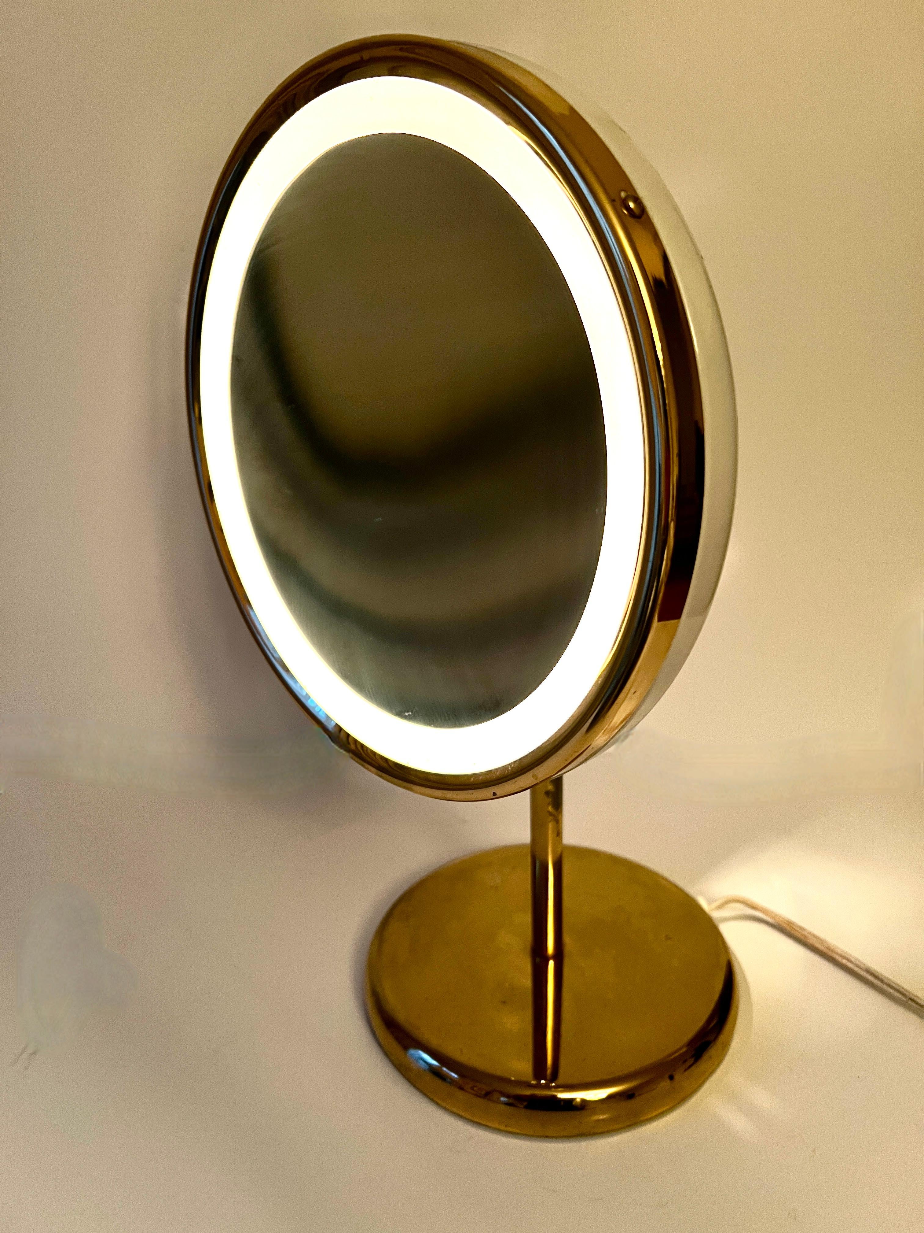 Mid-Century Modern Adjustable Magnifying Ring Lit Table Mirror on Brass Stand with Brass Details For Sale