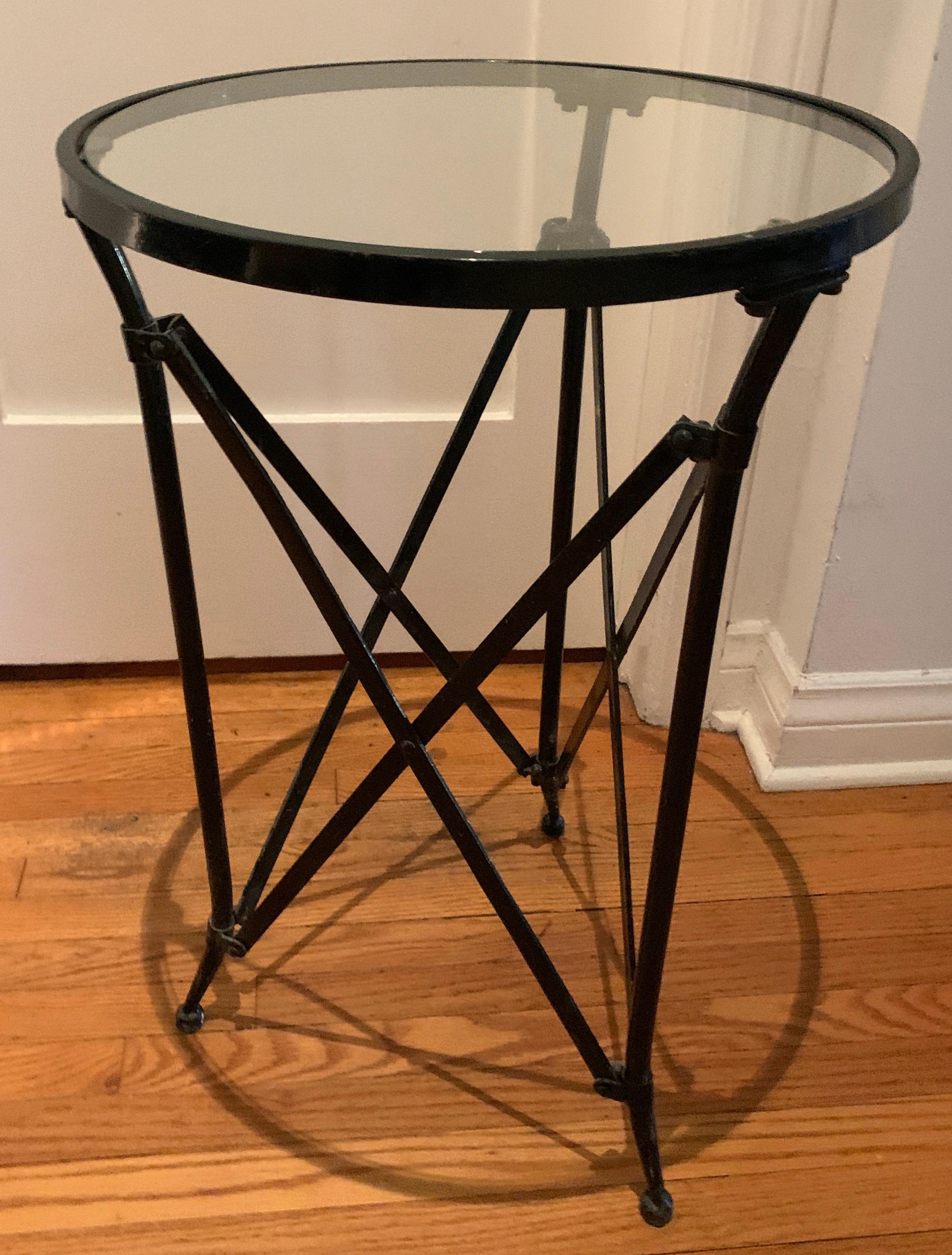 Metal frame table with adjustable slide metal legs.  While the legs look to adjust, they only appear to be manipulated, as the legs are more for the look... a well-made and nice side table.  

A nice side table to pull up or great for a guest room,