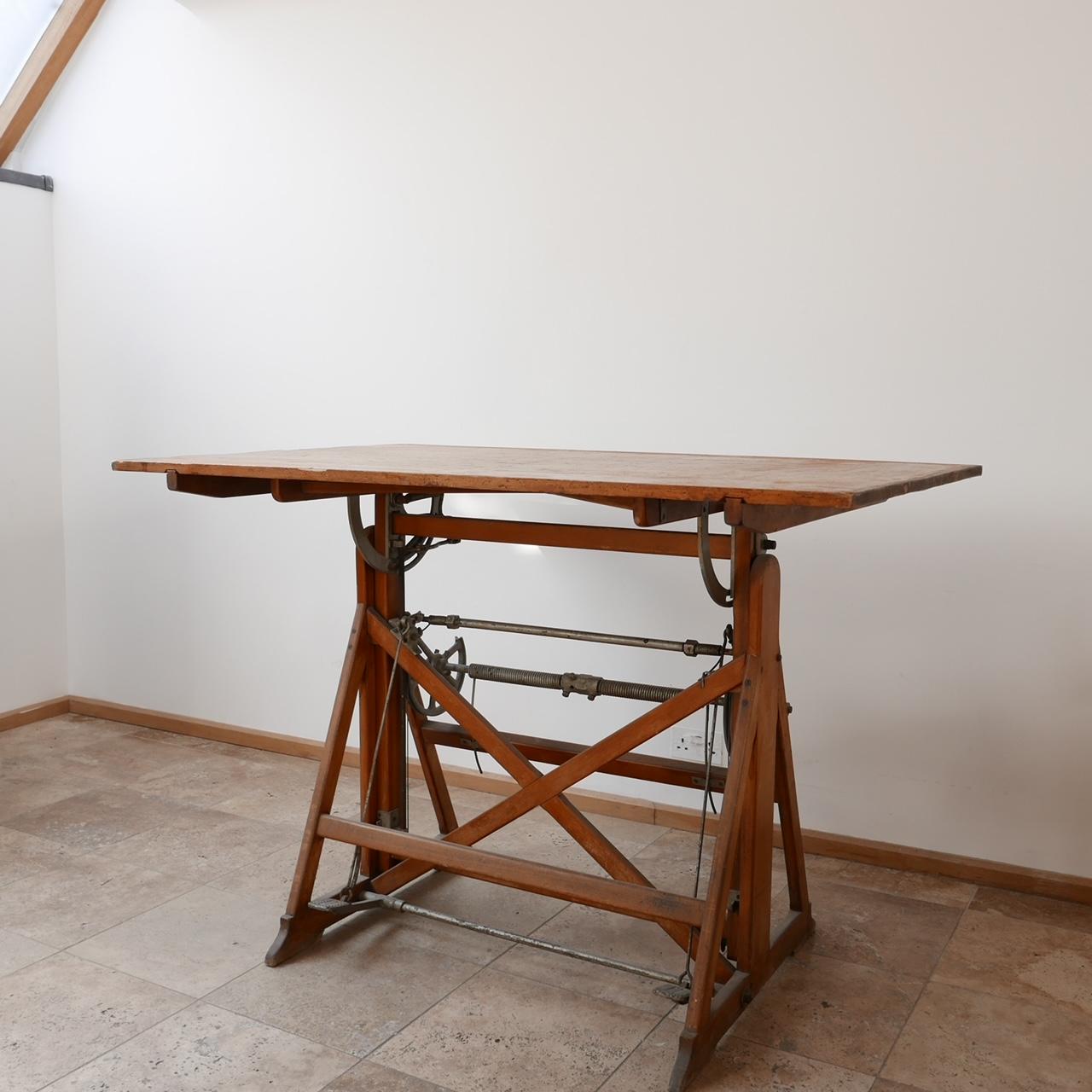 An adjustable desk or table. 

Italy, circa 1950s. 

Wooden and metal construction. 

Makers mark to base - 