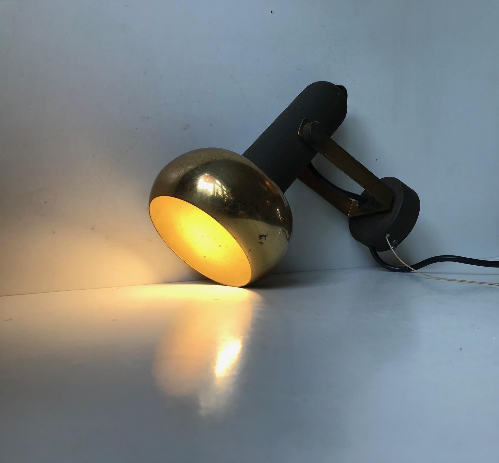 Fully adjustable sconce in brass. Designed and manufactured by Simon & Schelle - Sische in Germany during the 1960s. It features its original porcelain socket and on/of pull string.