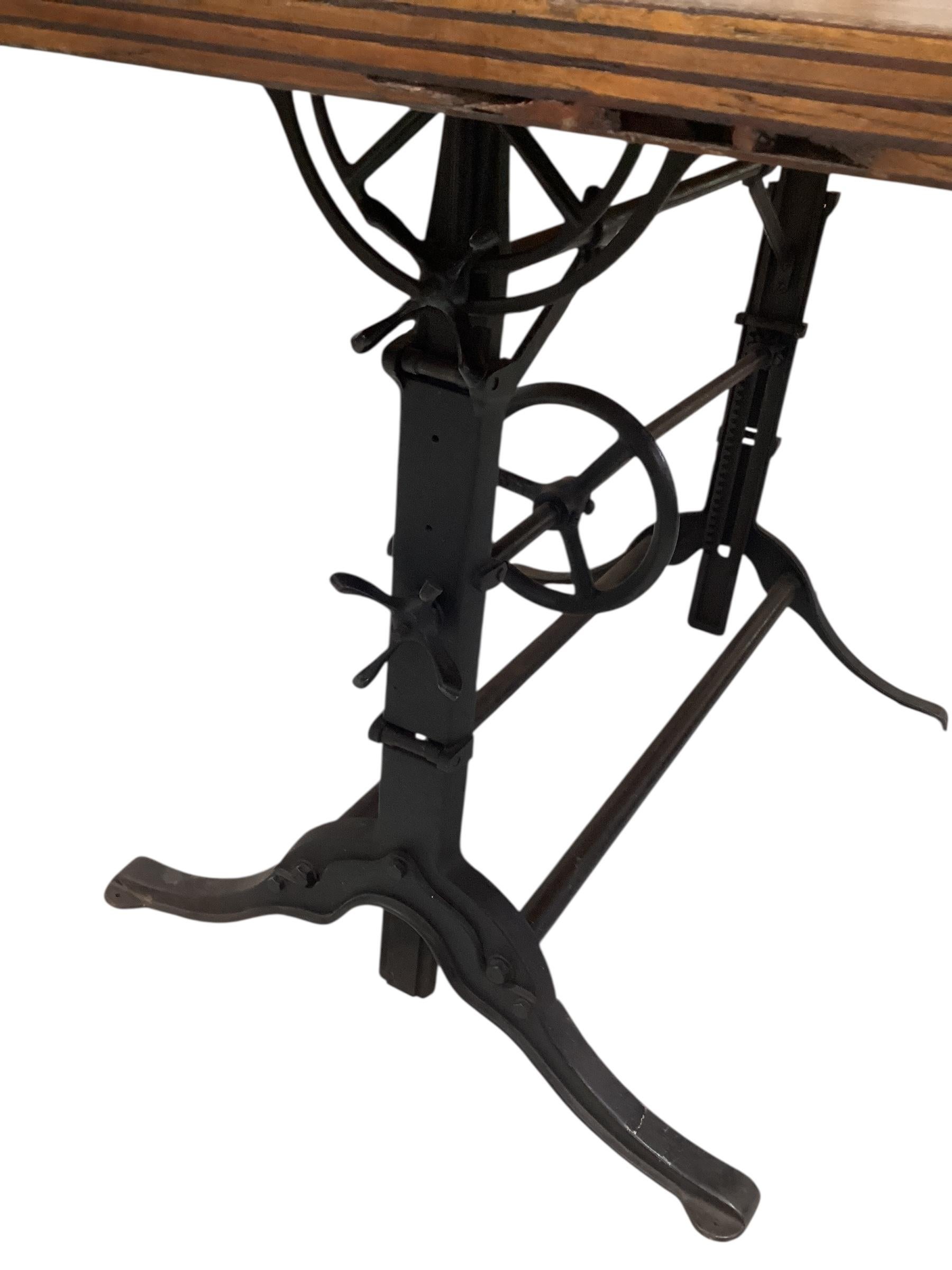 Early 20th Century Adjustable Oak Drafting Table With Cast Iron Base. For Sale