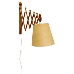 Adjustable oak wall lamp from Le Klint 