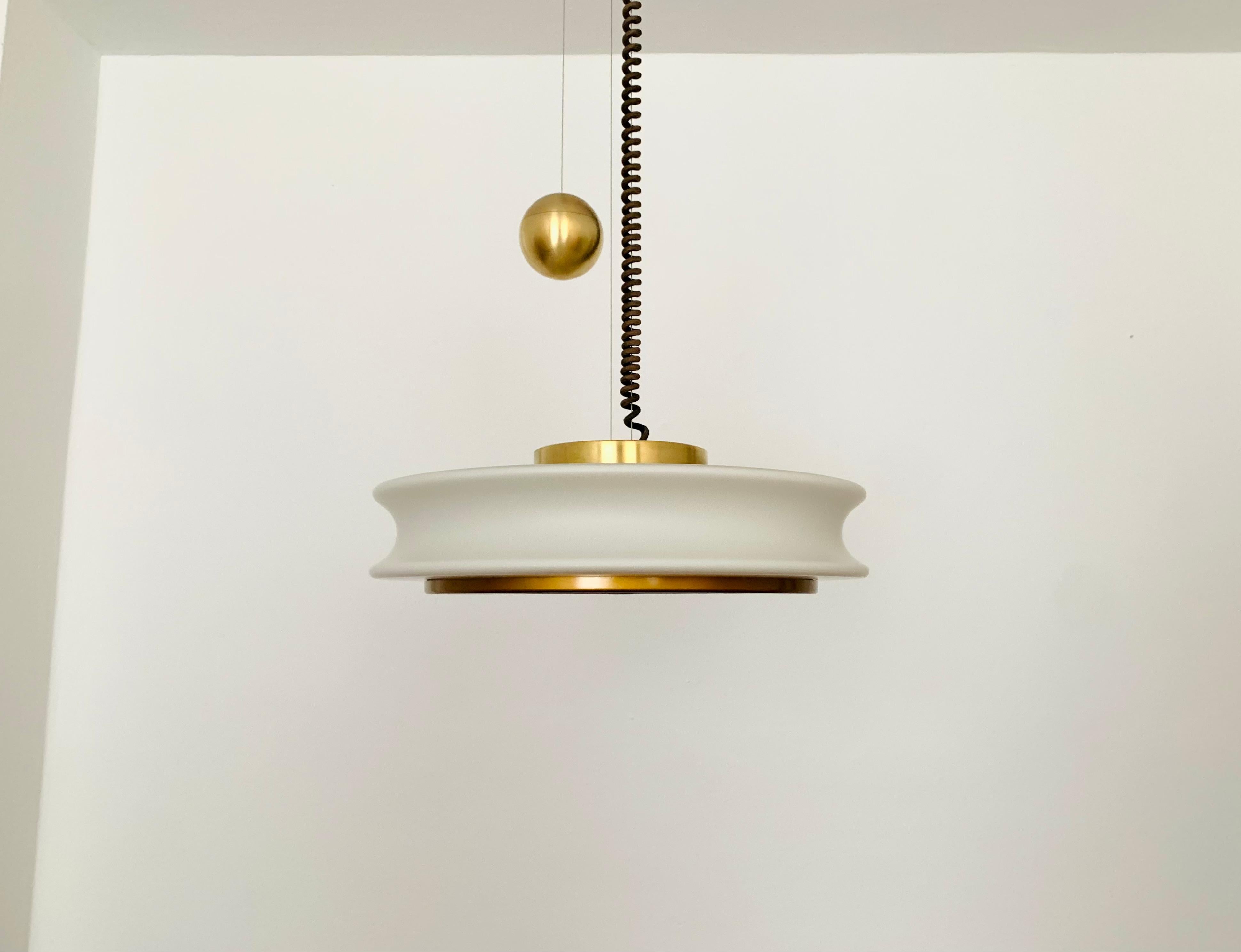Extremely impressive Orion pendant lamp from the 1960s.
Extraordinary design and a real highlight for every design lover.
The lighting effect of the lamp is extremely comfortable.
The frosted opal glass is particularly beautiful.
Very high