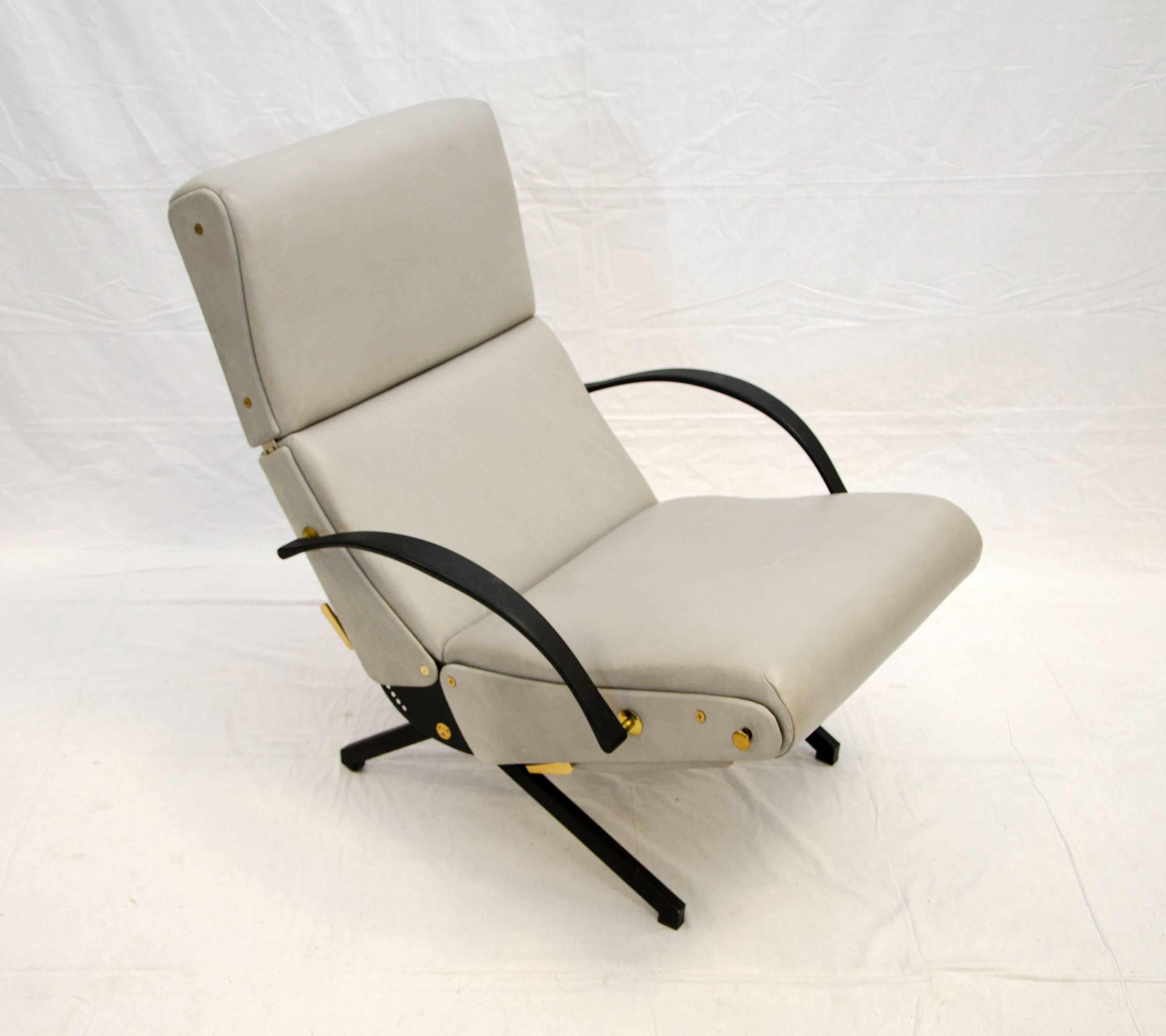 This iconic P40 lounge chair was designed by Osvaldo Borsani and manufactured by Tecno of Milan, Italy. The back, seat, headrest and footrest are each separately adjustable. This chair has been reupholstered with gray leather. The brass levers and