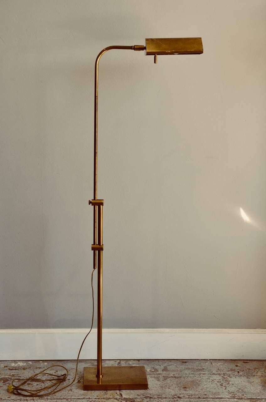 Adjustable patinated brass floor lamp by Frederick Cooper. Heavy weighted base.