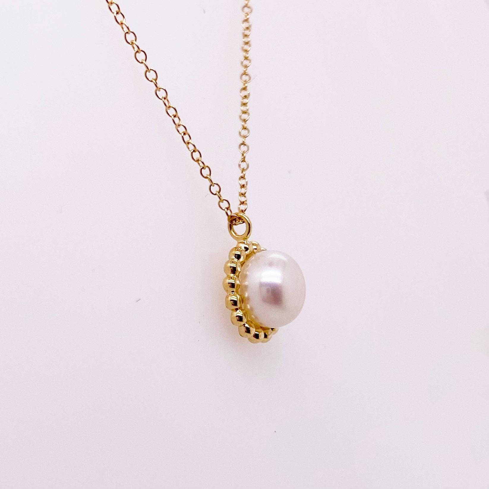 This lovely pearl necklace has a gold beaded frame around it.  It also matches a ring and earring set that we have listed on 1stDibs.  The necklace is stunning with one genuine cultured pearl in the center.  The chain has three setting so that you