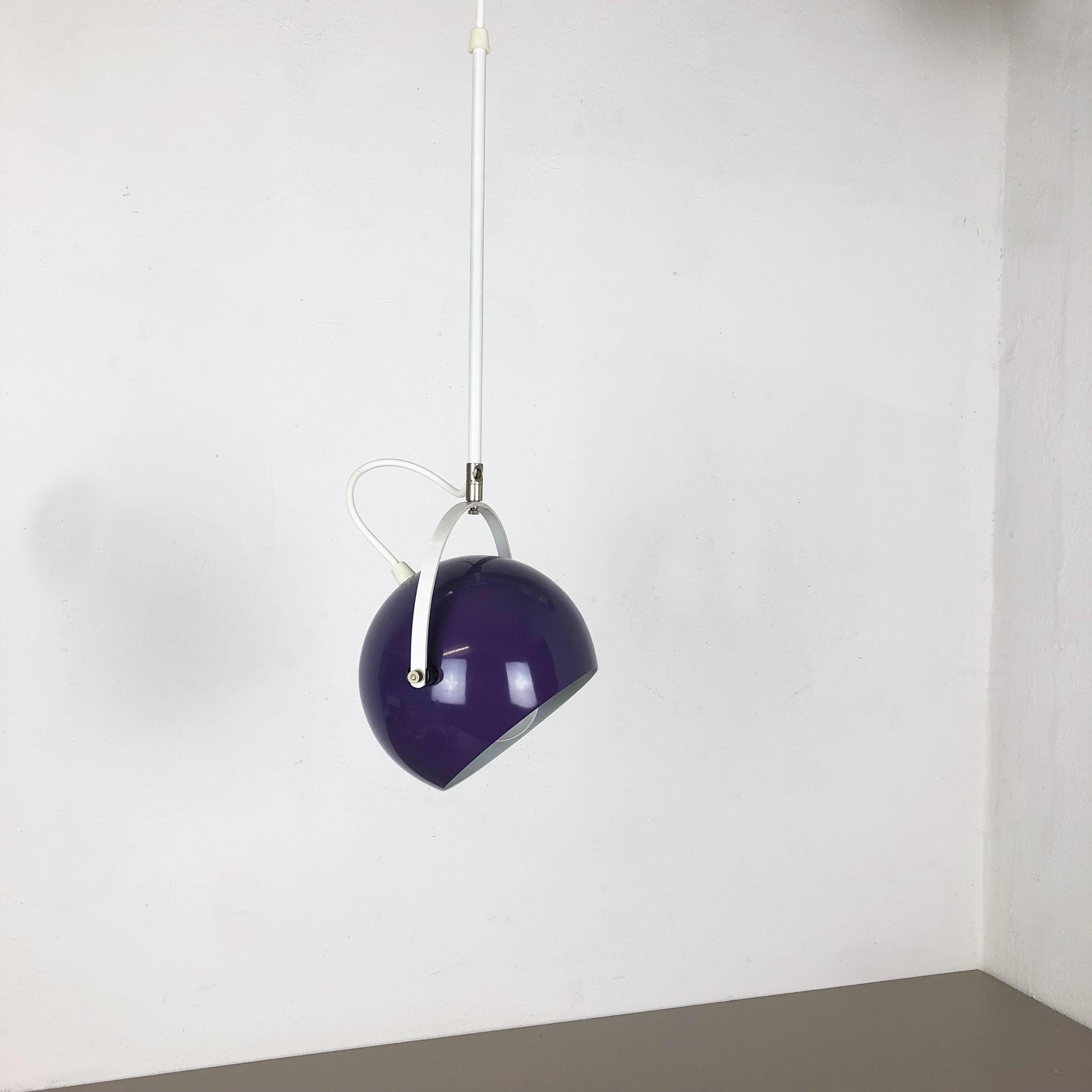 Purple spot hanging light.

Origin: Germany,

1970s.

This 1970s hanging spot light was made in Germany. The light has a purple colored spot which is fixed on a U-formed aluminum hanging mechanism. Due to this special hanging mechanism the