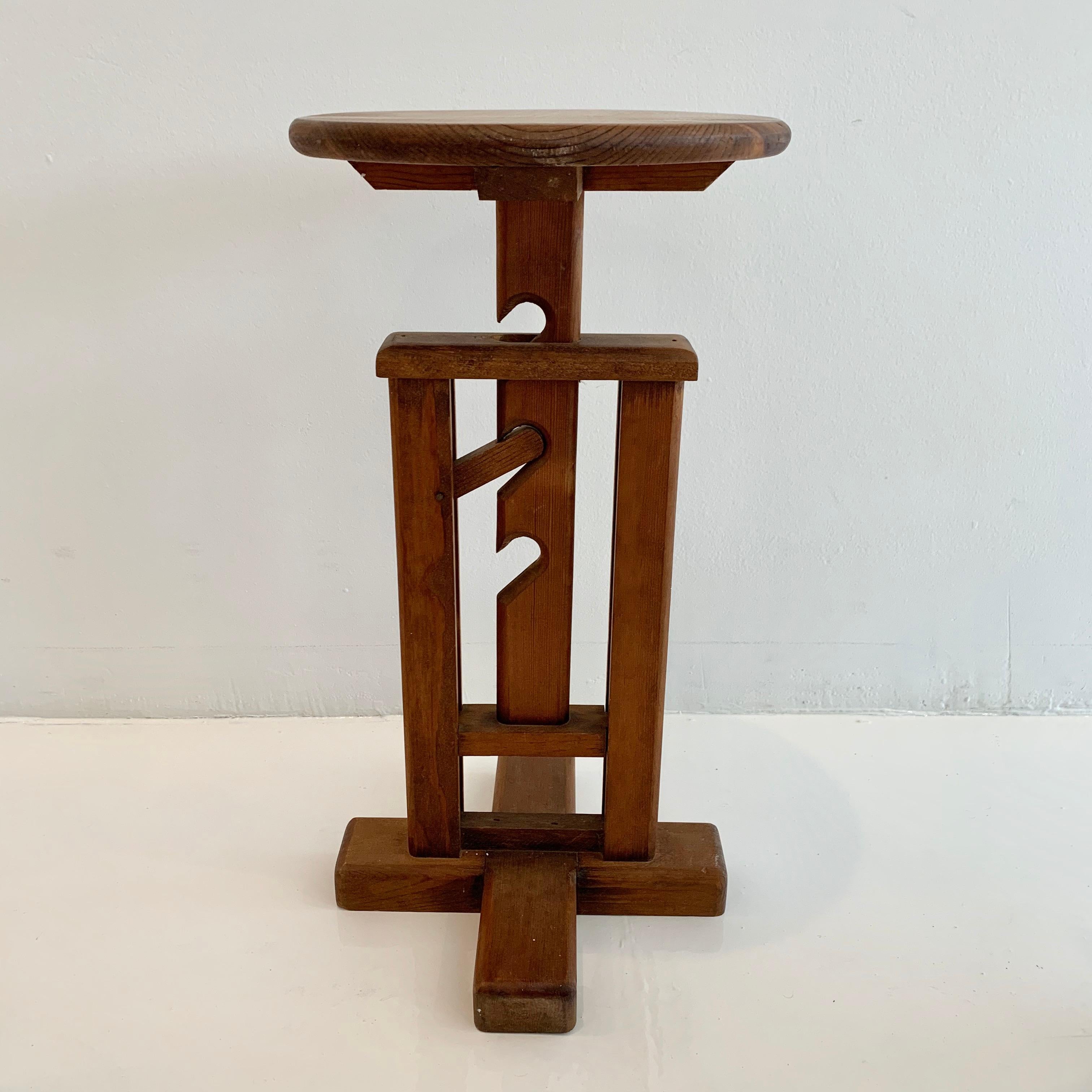 Very unusual wood farm stool. Stool can be adjusted in height from 18