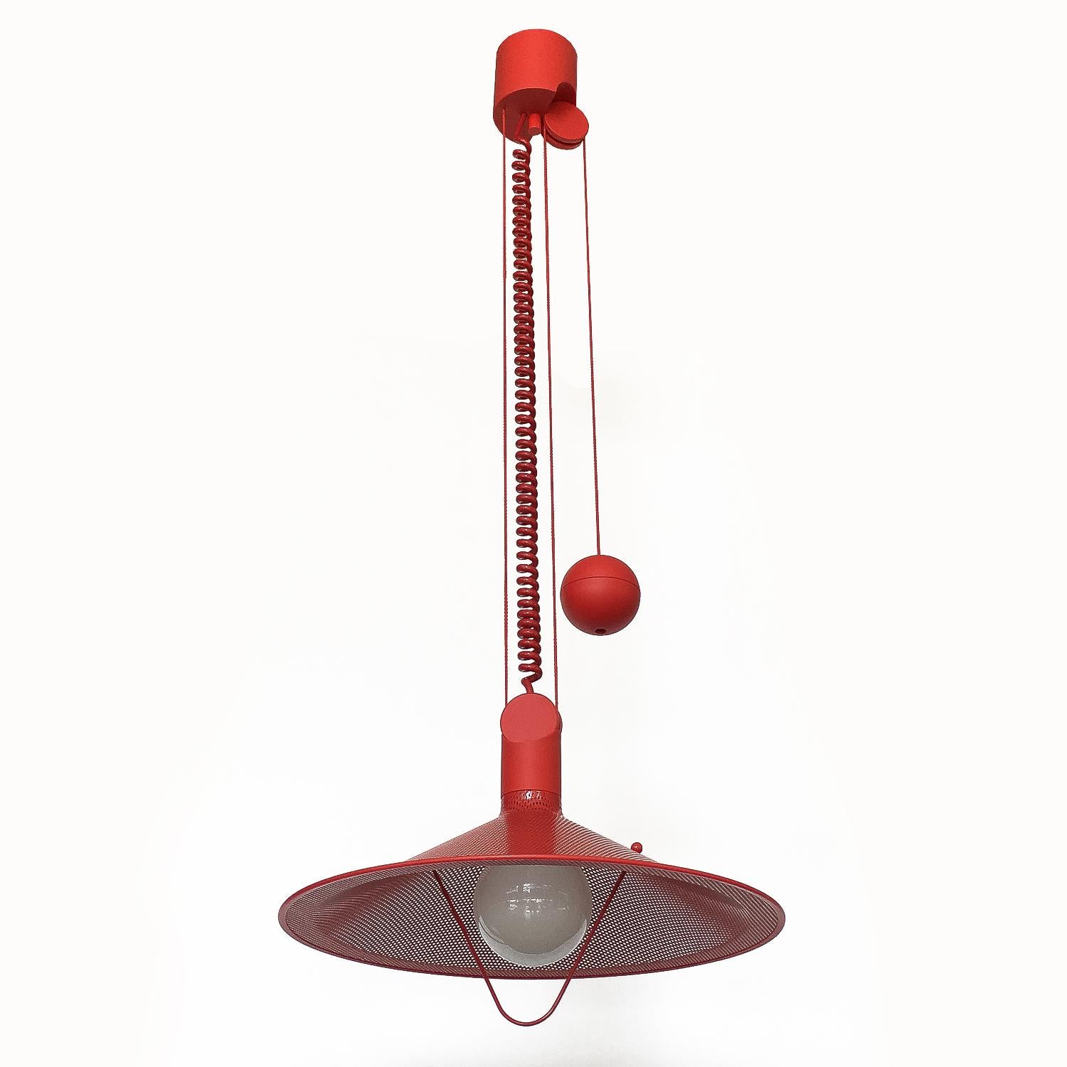 Rare West German Postmodern pendant chandelier, circa 1980s. Striking and unique all red construction. Red enameled perforated metal shade, red plastic pulley system, canopy and 3