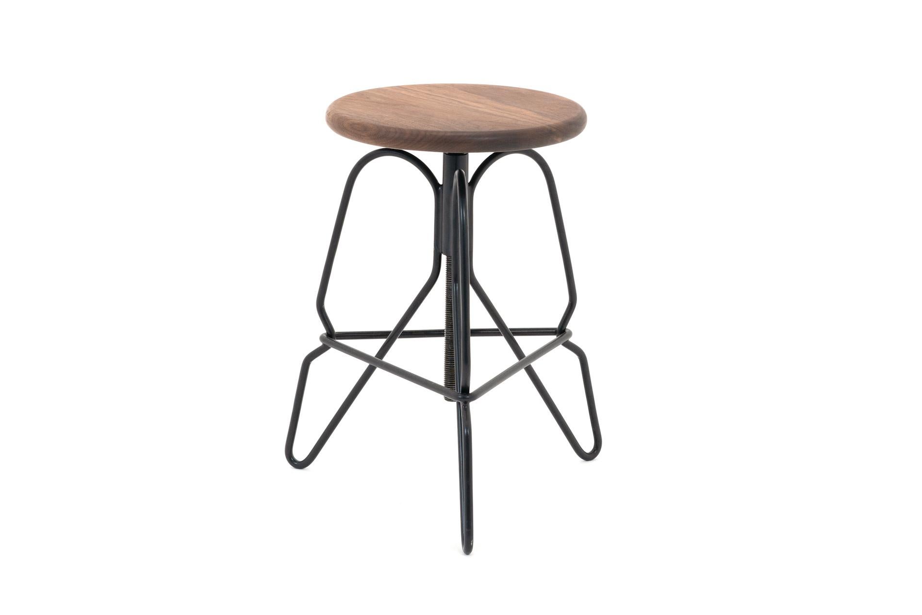 The rig stool is a minimal solid steel stool featuring an adjustable solid wood seat on a threaded rod. The legs are tied together with a triangular footrest.

This handcrafted piece is hand-oiled using our in-house oils and techniques and