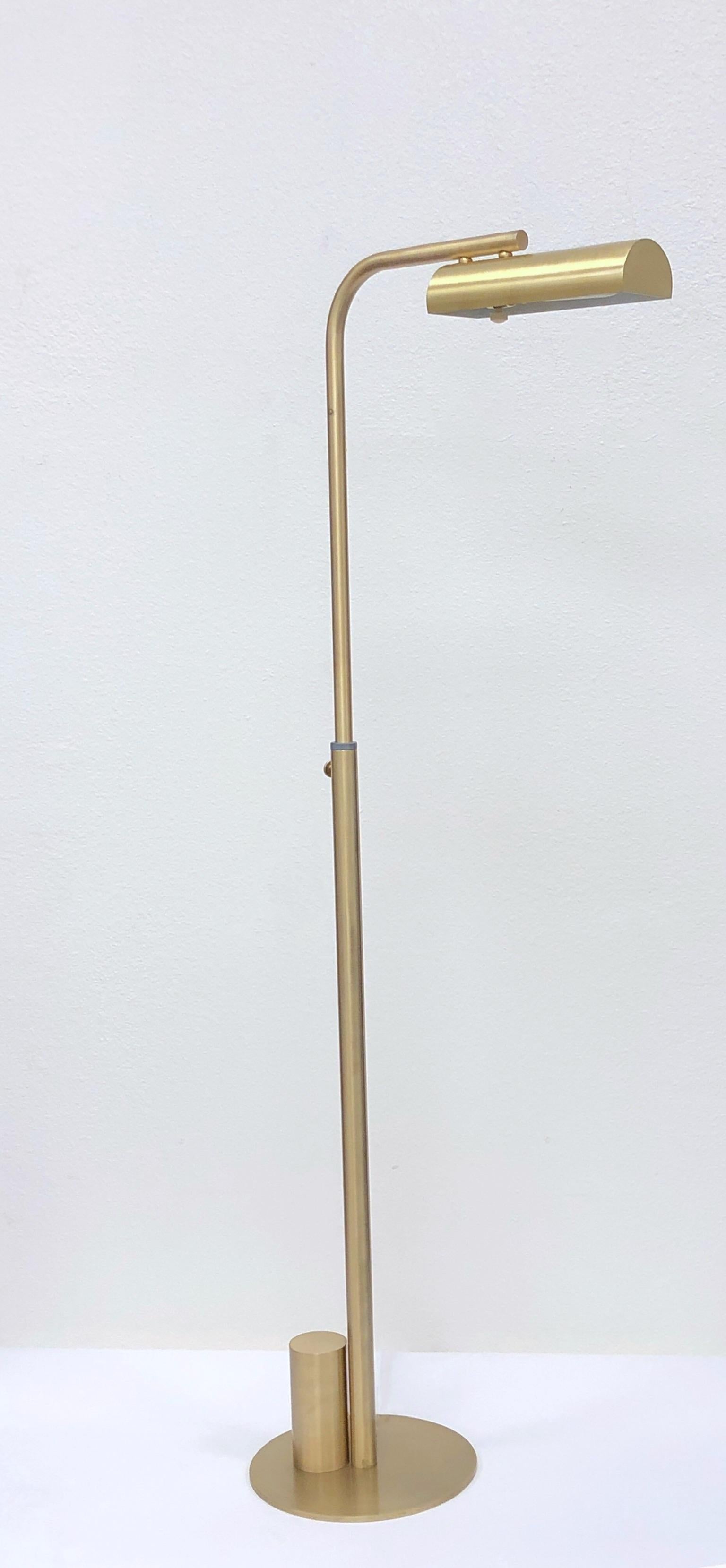 1970’s adjustable satin brass floor lamp designed by Charles Hollis Jones.
It raises, lowers and rotates 360*.
Newly rewired with full range dimmer. 75w Max. 
 Measurements: 16.25” Wide 9.75” Deep 50” High as shown.
 