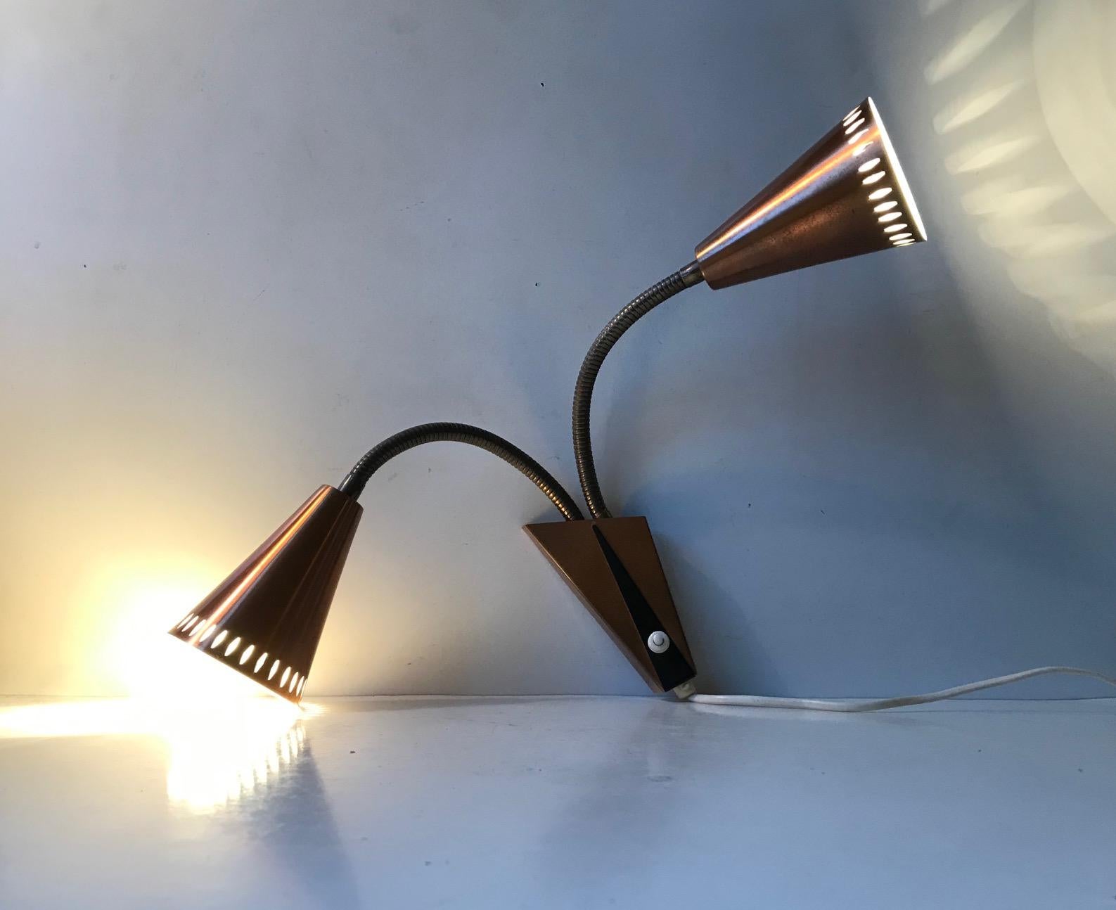 A Swedish modernist double wall light made of partially perforated copper. Designed and manufactured by ASEA in Sweden during the 1950s in a style reminiscent of Paavo Tynell and Hans Bergstrom. The light will be sold and shipped in working order.