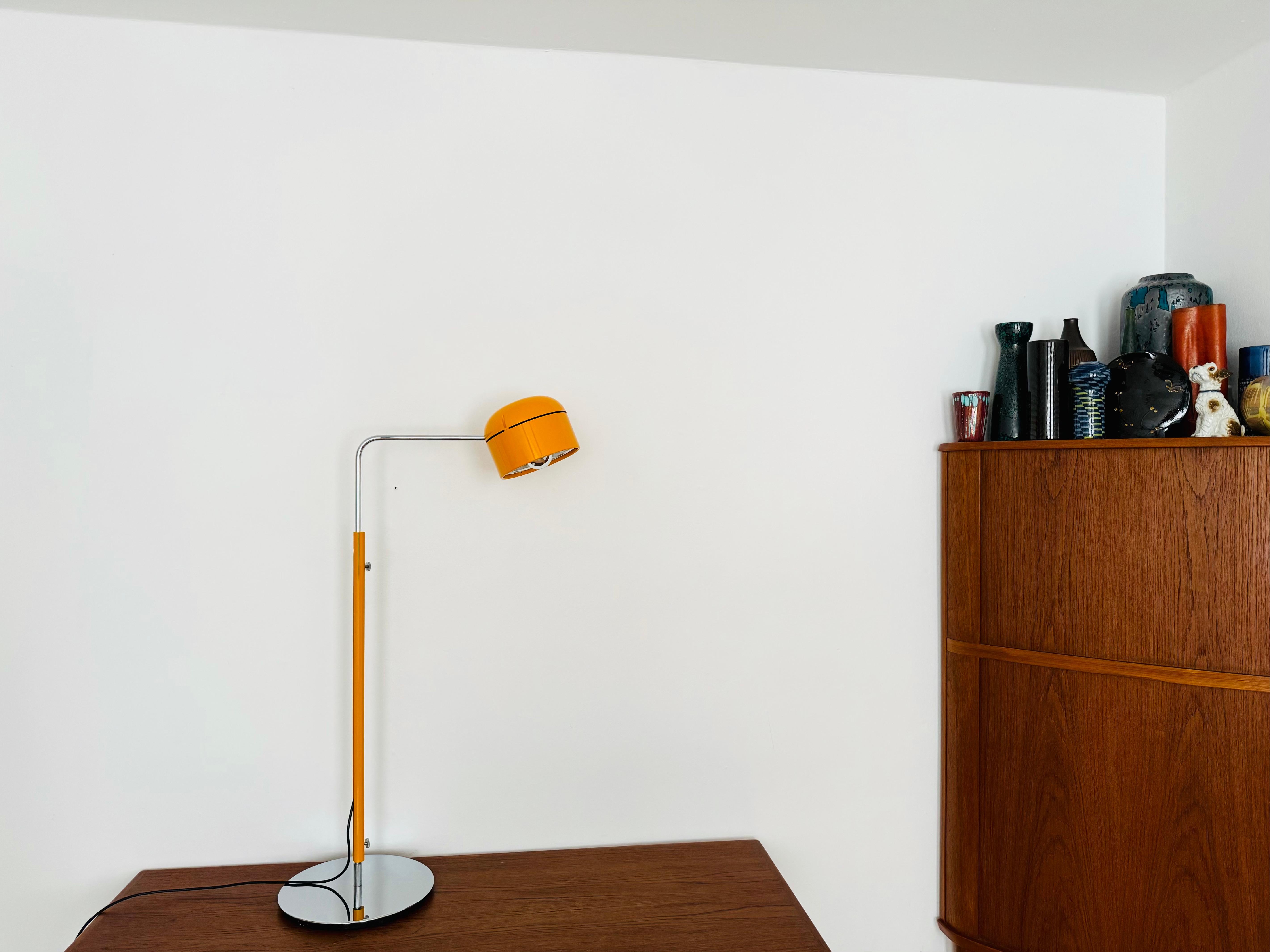 
Fantastic floor lamp from the 1970s.
The Staff brand is known for its high-quality workmanship and perfectionist design.
The large yellow-orange lamp head is infinitely adjustable.
The mirror reflector creates a focused light so that you can