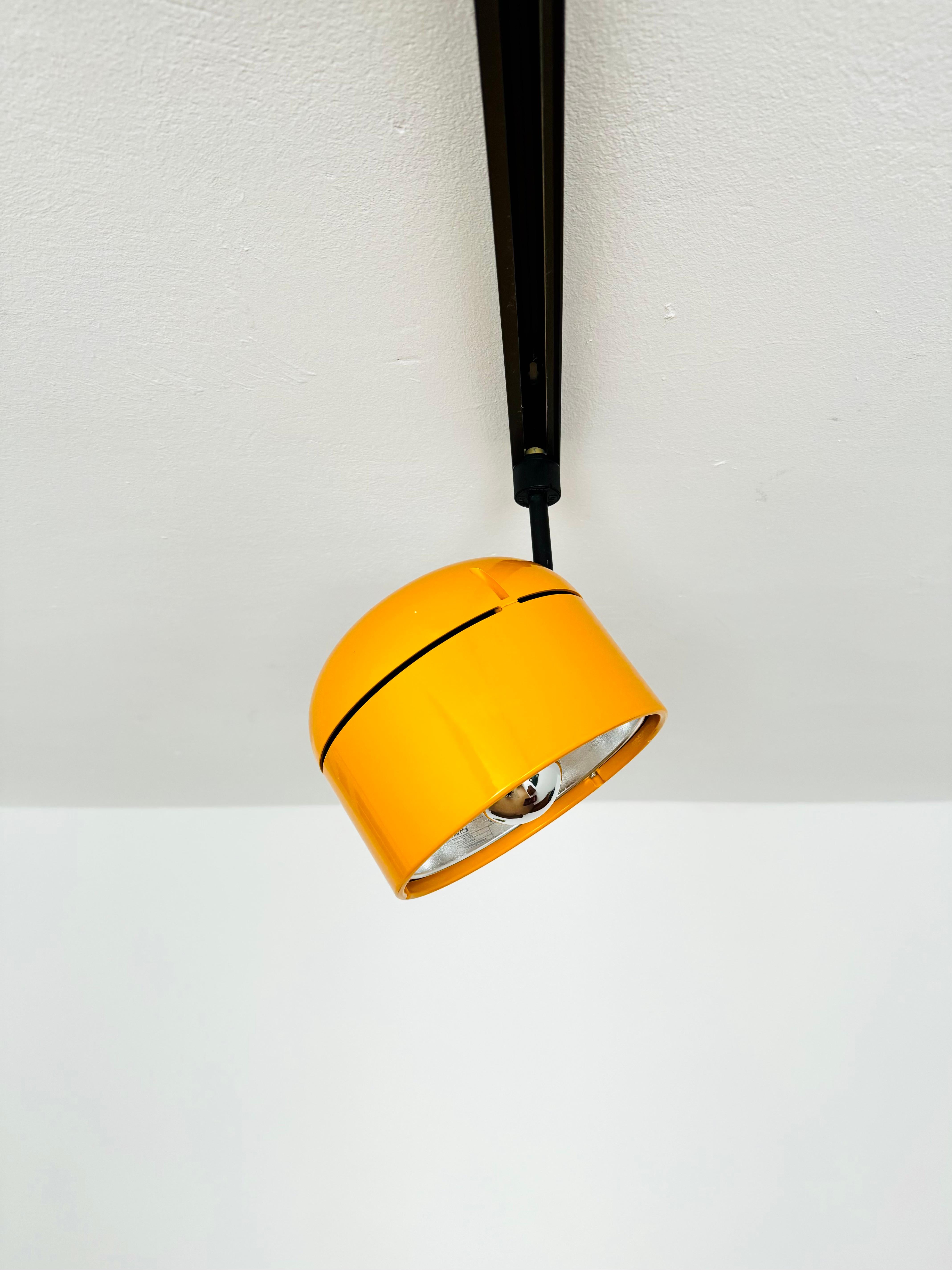 Fantastic 3-phase track lamp from Staff from the 1970s.
The Staff brand is known for its high-quality workmanship and perfectionist design.
The large yellow-orange lamp head is infinitely adjustable.
The mirror reflector creates a focused light so