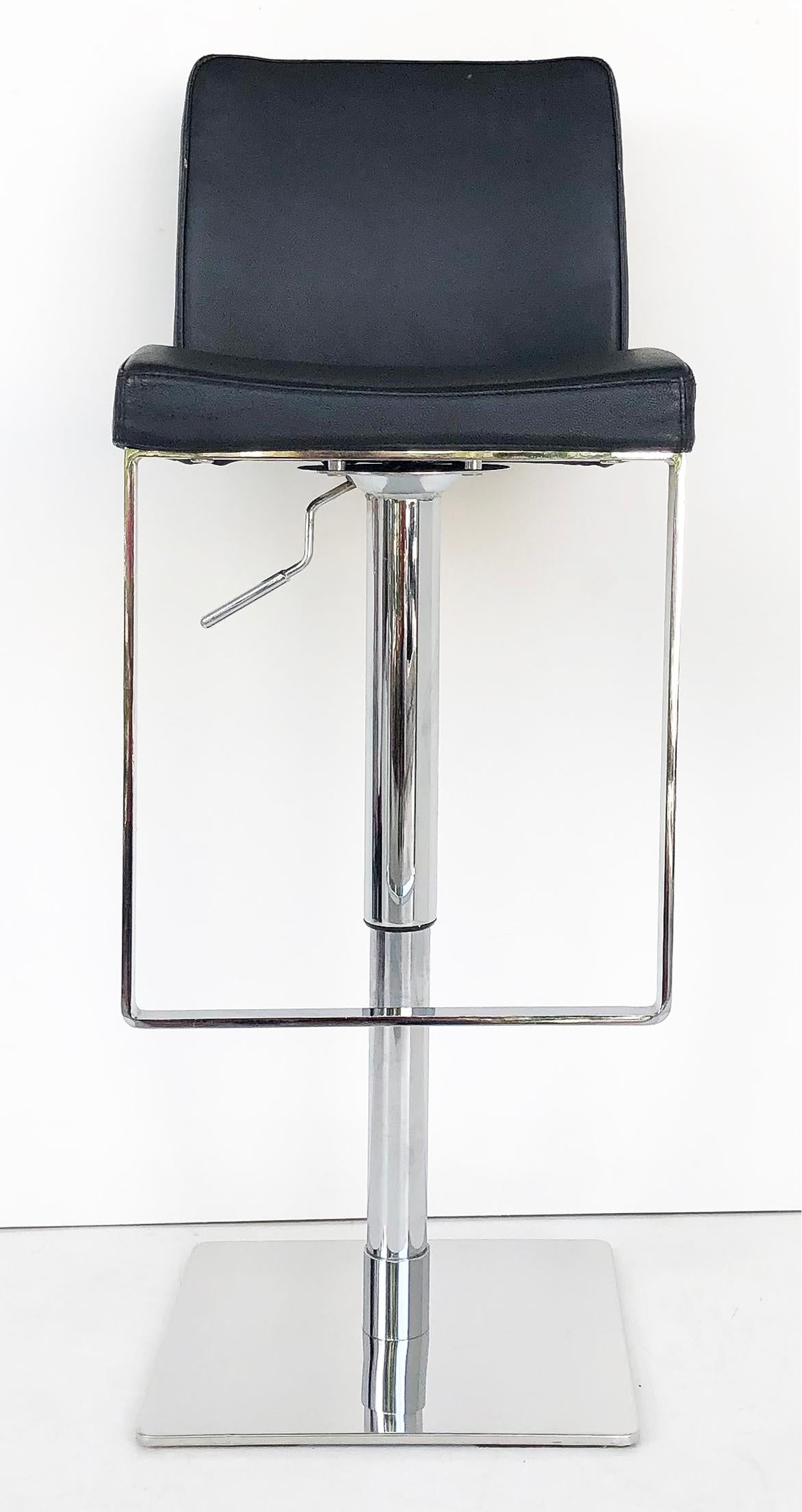 Adjustable stainless steel/leather counter/bar stools, set of 3

Offered for sale is a set of three stainless steel and bonded leather stools that can be adjusted to fit either bar height or counter height. These are great when you have a