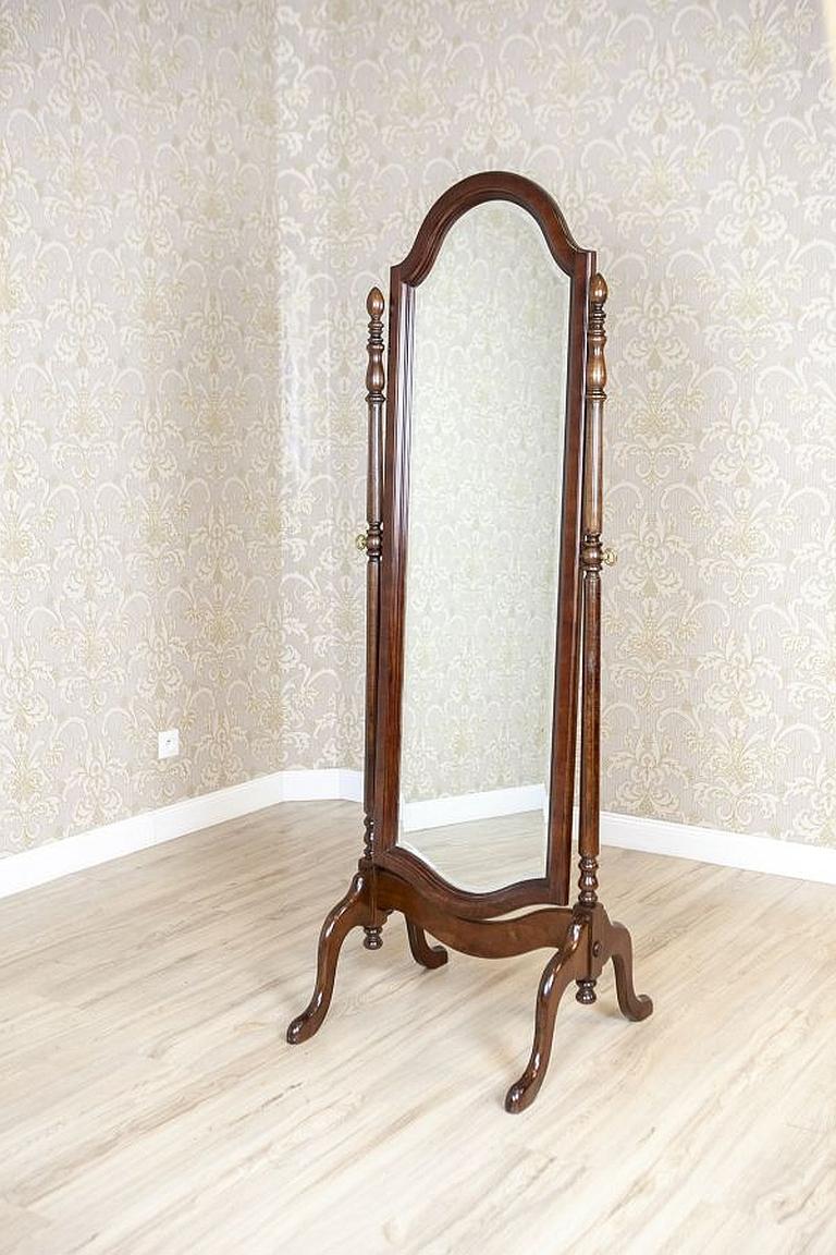 Adjustable Standing Mirror from the Early 20th Century in Mahogany Frame

We present you this high standing crystal mirror in a special mahogany frame which makes adjusting the angle of the mirror possible. The mirror is chamfered and placed in an