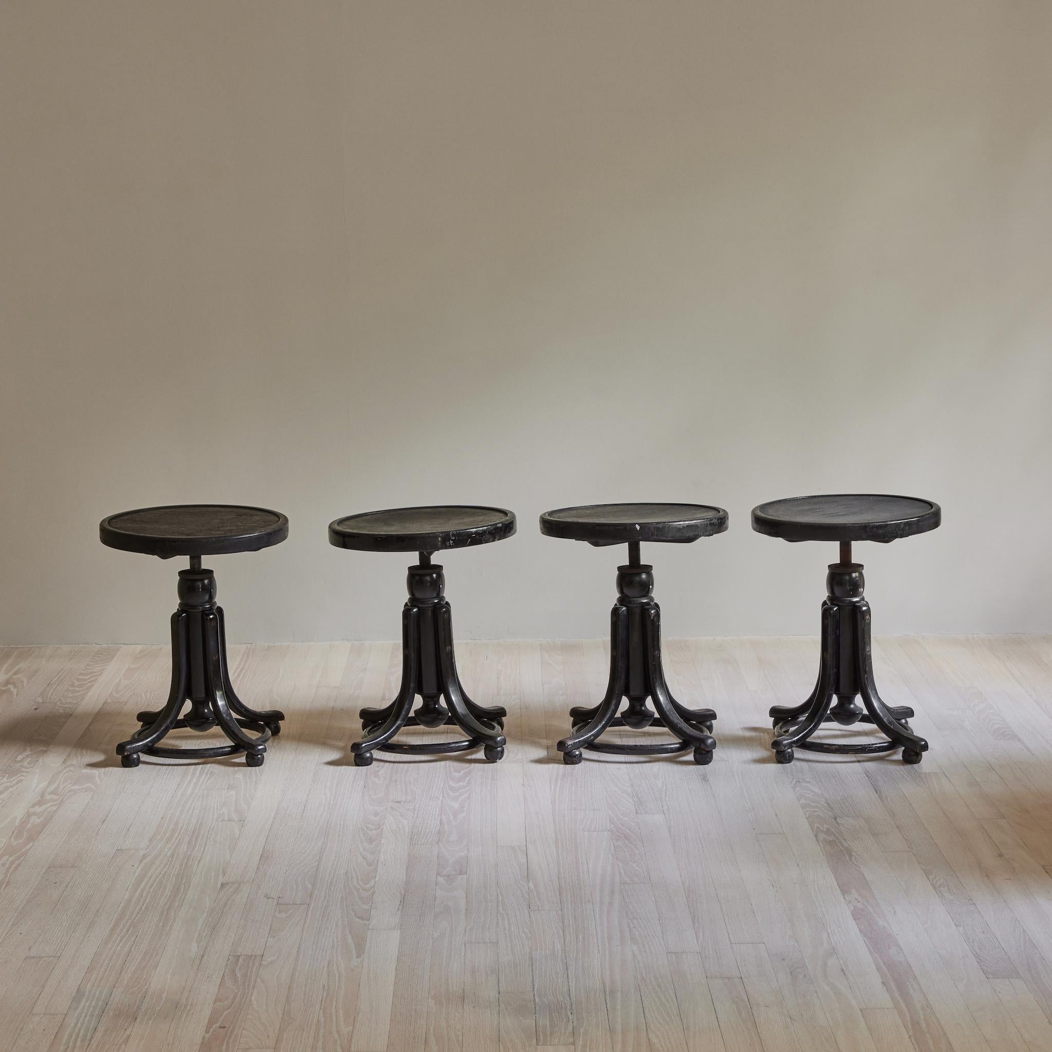 Two of four wooden adjustable stools by Thonet (an Austrian company) commissioned by a company in France. Seat adjusts from 17-21.5 inches. (Two sold)