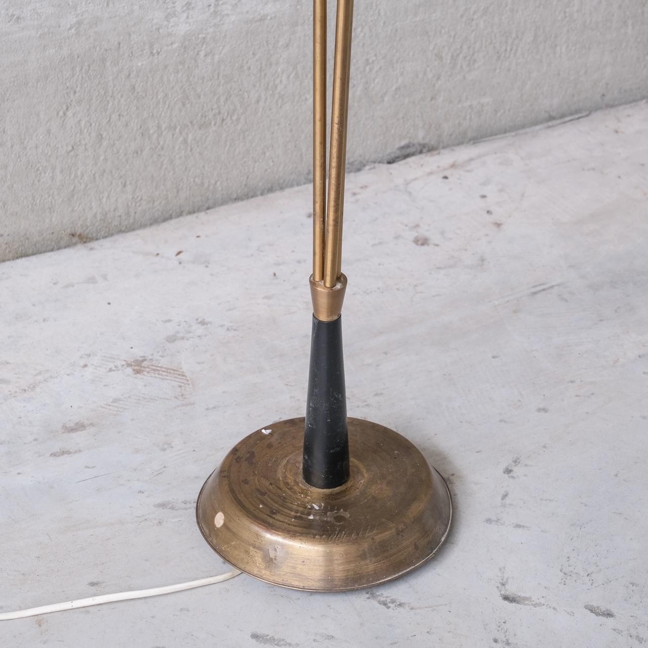 A brass adjustable three stem floor lamp.

Sweden, c1960s.

Adjustable and directional.

Since re-wired and PAT tested.  

Good vintage condition, some scuffs and wear commensurate with age.

Internal Ref: 5/9/23/002.

Location: Belgium