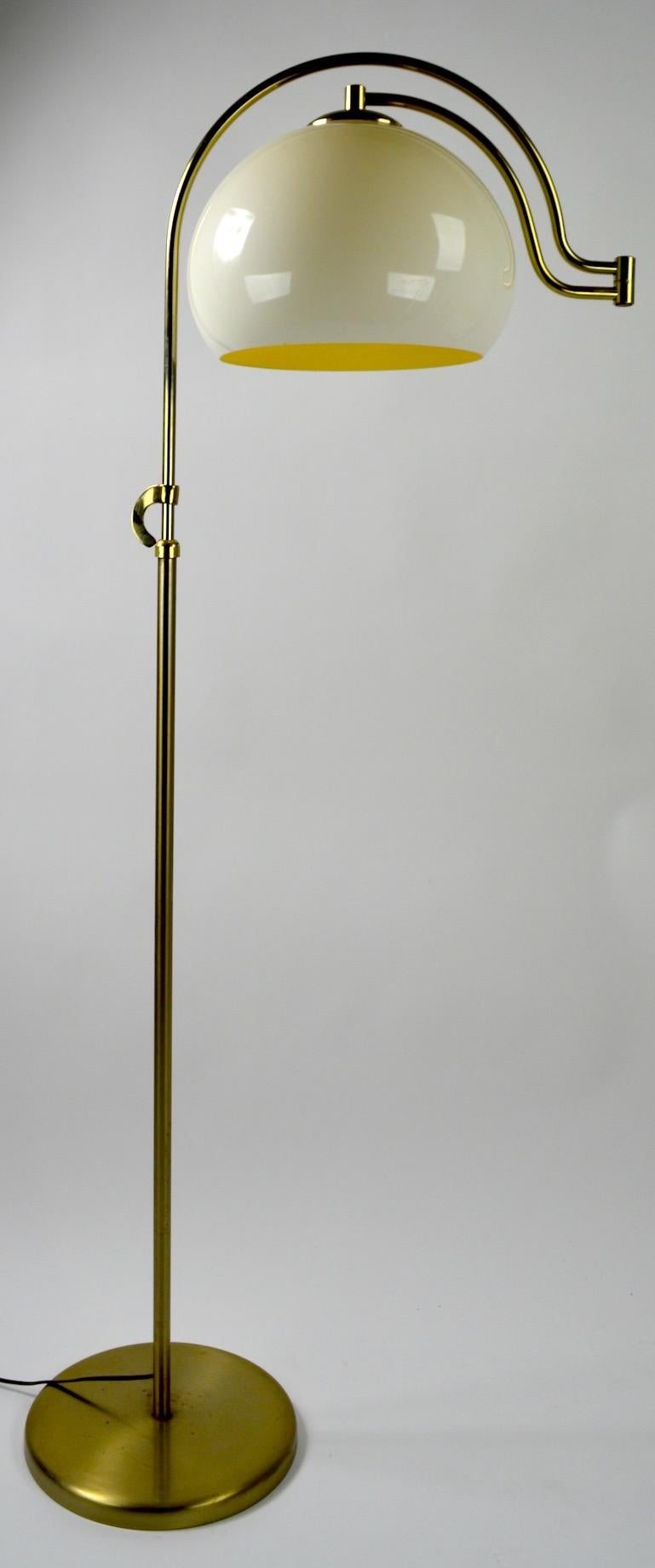 Interesting adjustable floor lamp by the Laurel Lamp Manufacturing Company. This lamp is adjustable in height (Low position 52 inch H x 69 H in High position ) in addition, the arm swings and is jointed to move the plastic shade exactly where you
