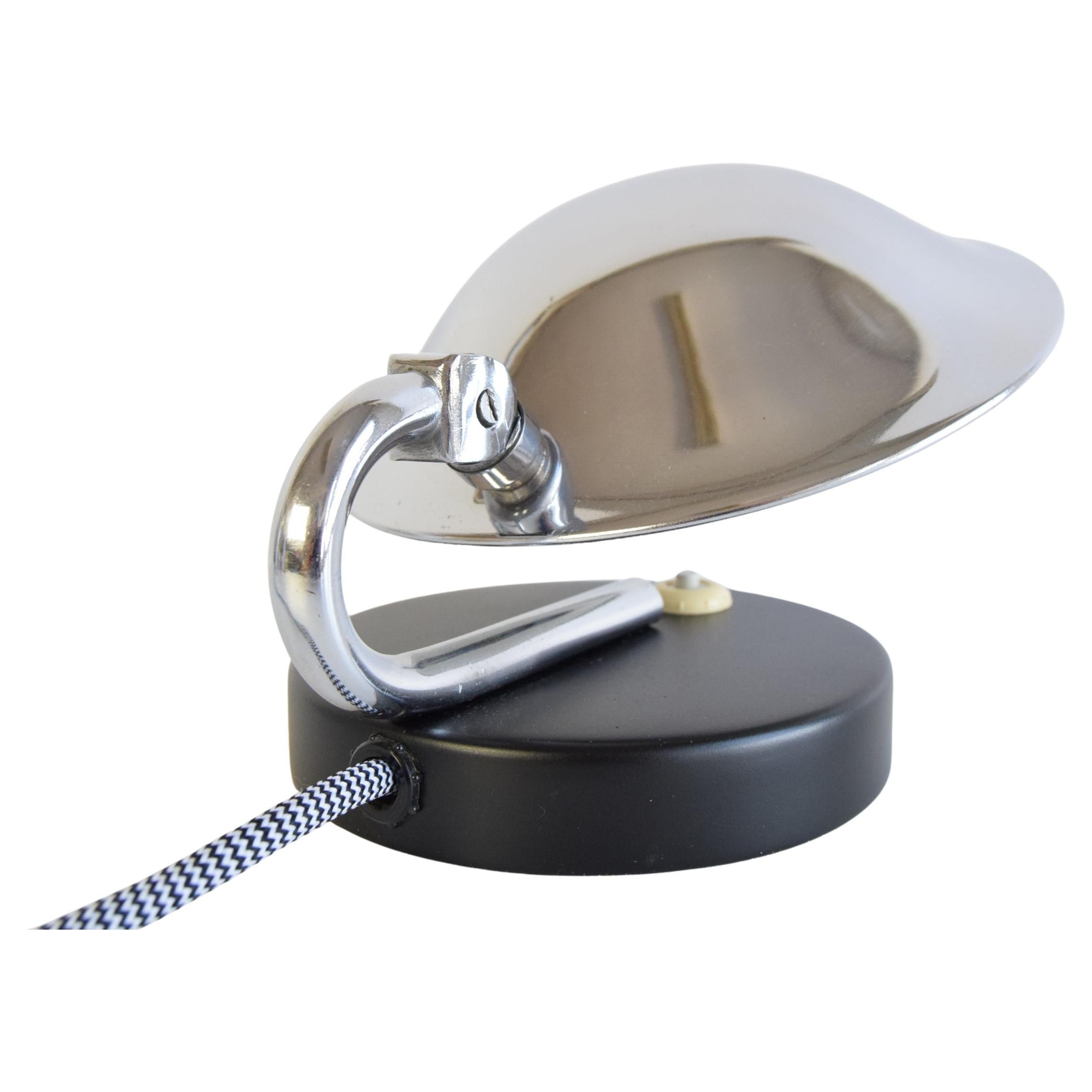 
Functional/Bauhaus table or bedside lamp, made in Napako in Czechoslovakia in 1930.
Adjustable Shade 
New Cabling 
1x40W, E14 or E15 bulb
US adapter included
The lamp base has been repainted
