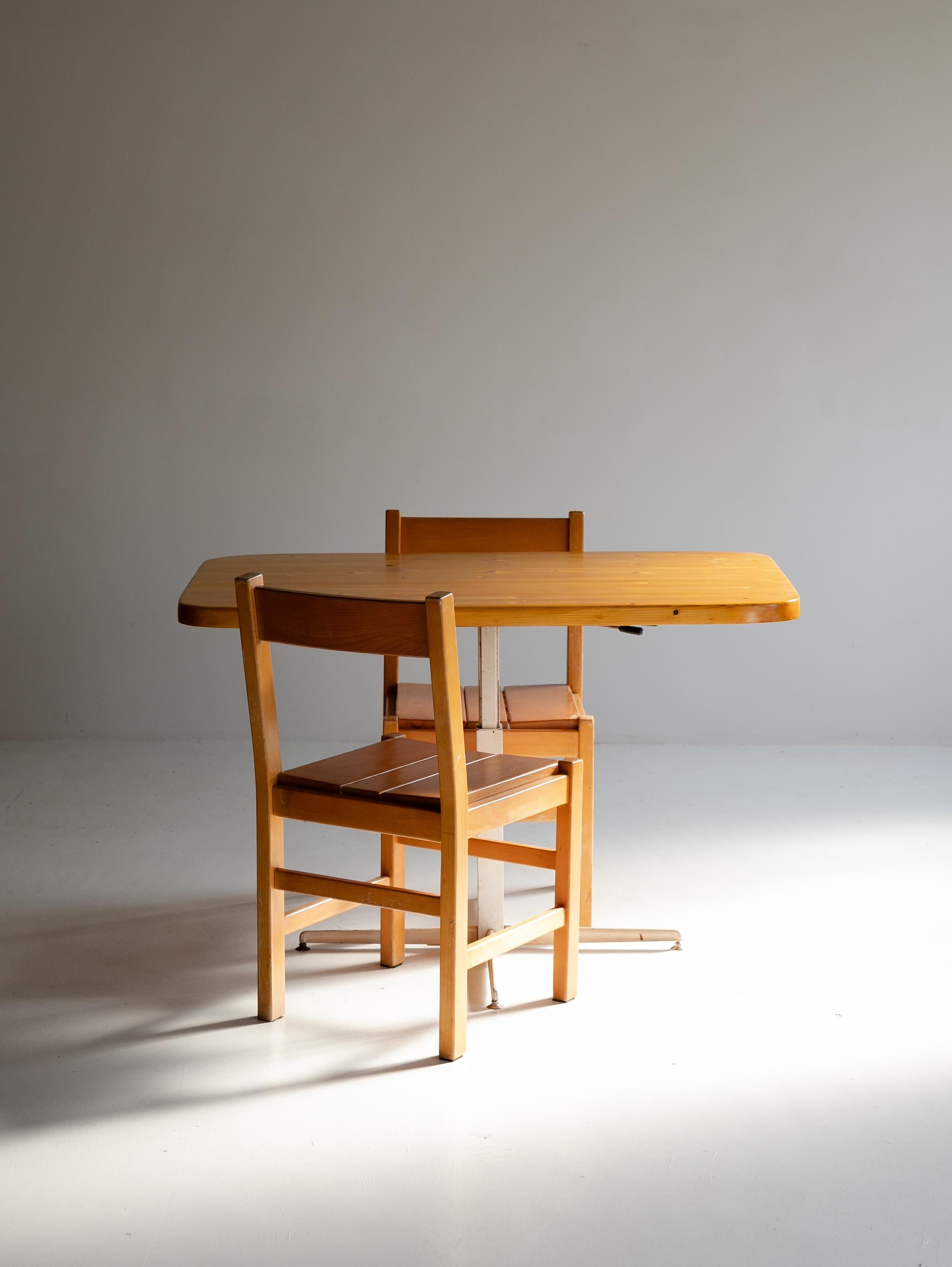 Introducing a masterpiece designed by French designer Charlotte Perriand in the 1970s, specifically for the Les Arcs ski resort in France.

This rectangular table features rounded edges and adjustable height, blending elegant functionality that