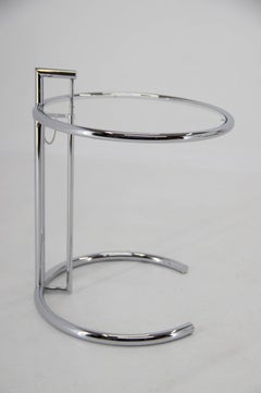 Adjustable Table E 1027 in Chrome and Crystal by Eileen Gray