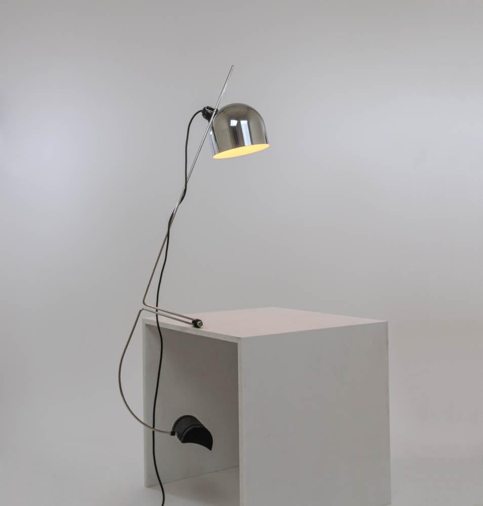 Adjustable table lamp designed by Vid Brataševec and manufactured by Lumenform, 1970s.

The lamp consists of a chrome-plated adjustable reflector, a slim frame and a relatively heavy cast iron counterweight. Just below the center of the frame the