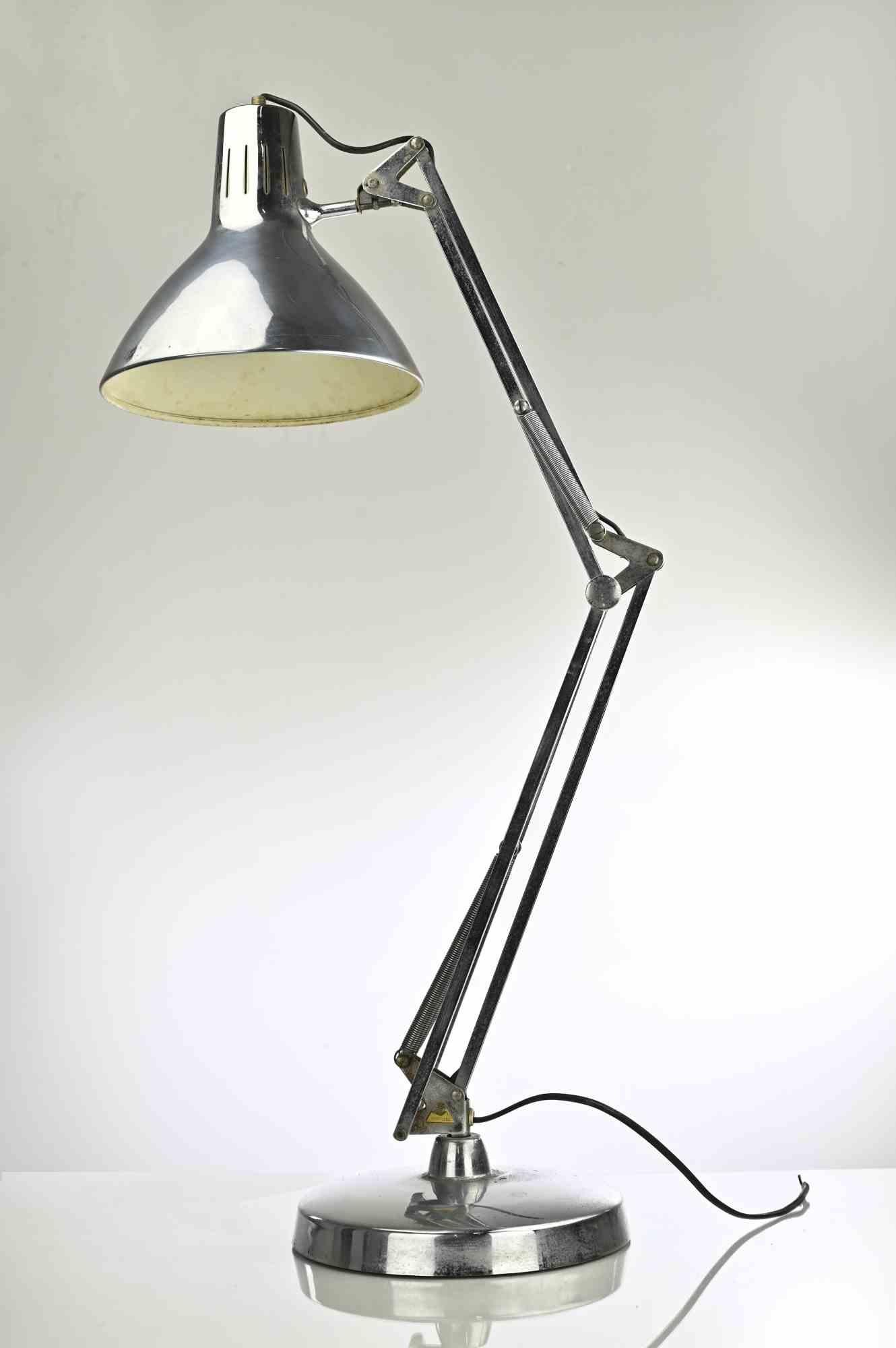 Lampe de table réglable en métal chromé, Italie, années 1970.

Bon état de fonctionnement.