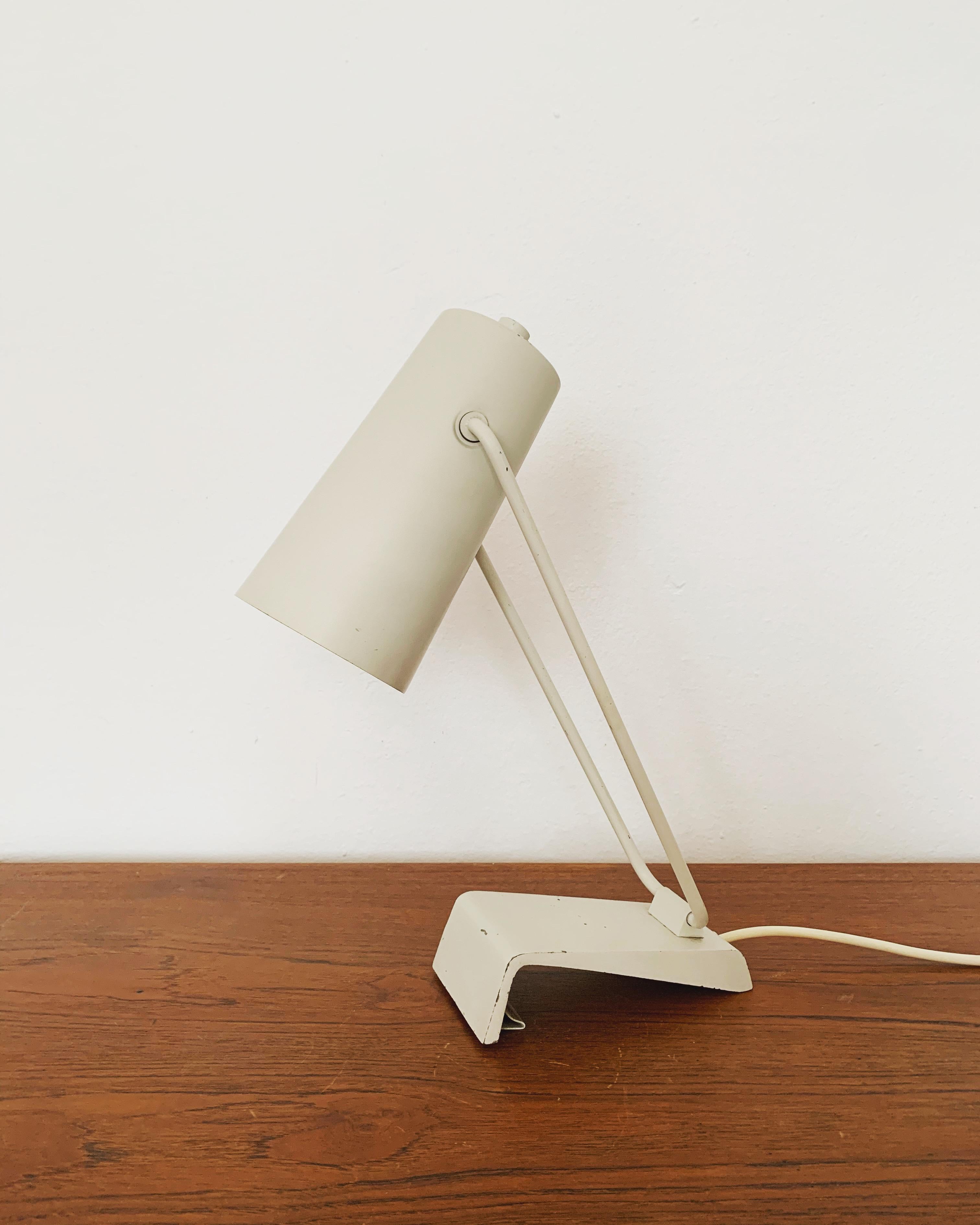 Wonderful industrial Bauhaus lamp from the 1950s by Kaiser Leuchten.
Fantastic mid-century design.
High quality.
The lamp can be used flexibly as a table lamp or as a wall lamp.
The lampshade is flexibly adjustable.

Manufacturer: Kaiser Idell