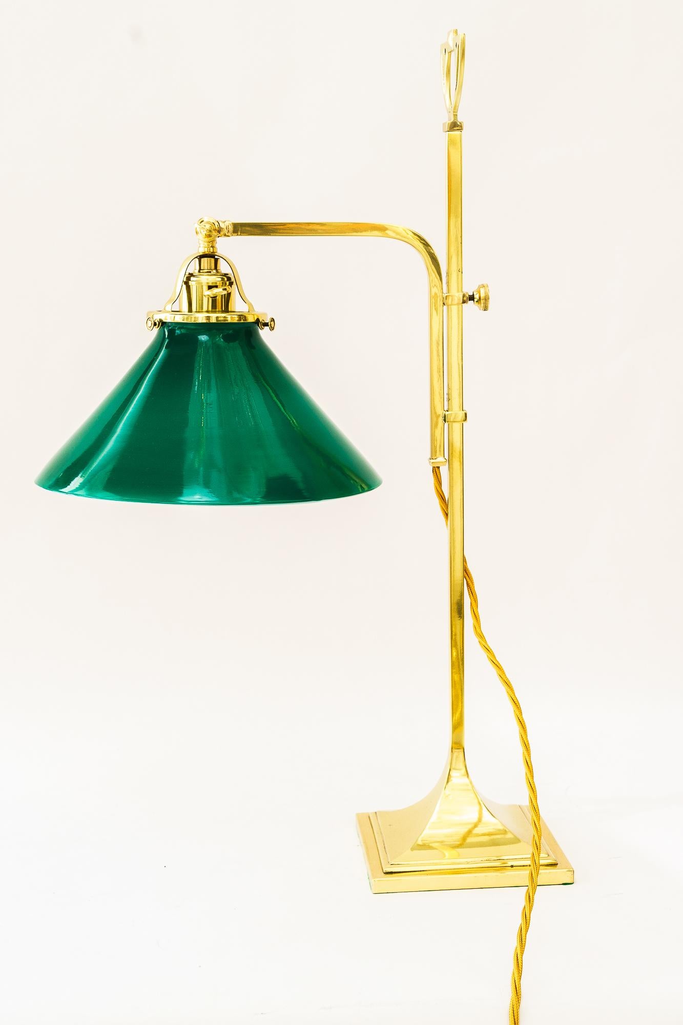 Adjustable table lamp with original opal glass shade vienna around 1920s
Brass polished and stove enameled
Original opal glass shade 
