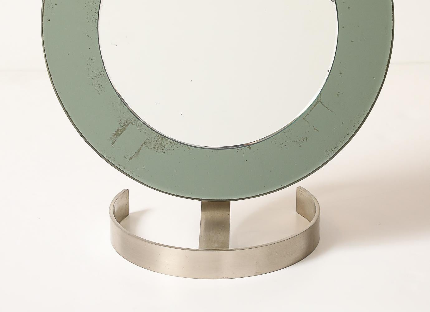Wide smoked-glass border with beveled edge. Curved base of flat-banded steel. Excellent quality and very stylish piece.