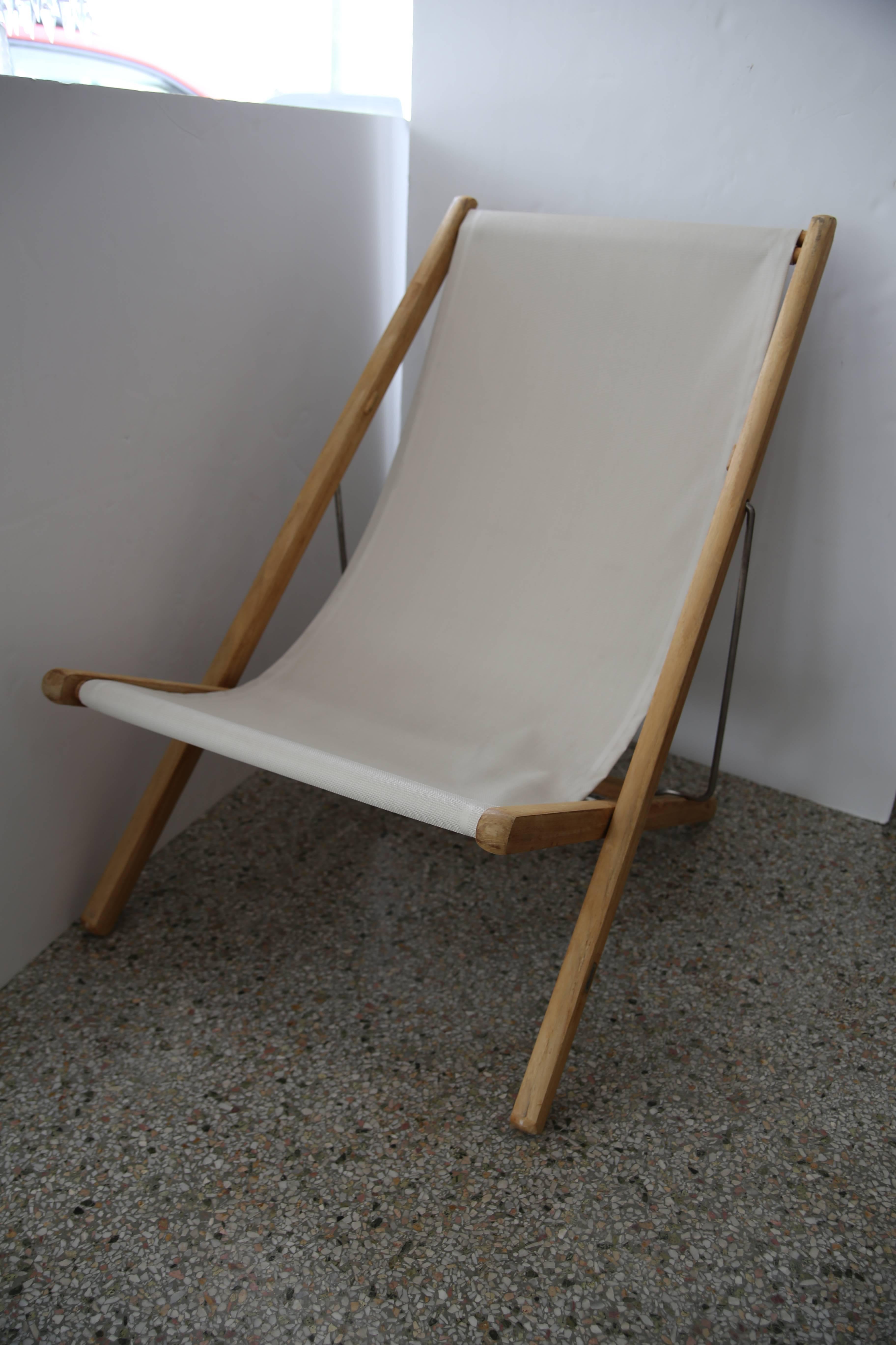 These stylish, chic adjustable teak patio chairs were acquired from a Palm Beach estate and they were produced by the firm of Gloster and date to the early 21st century.

Note: Where the seats start to curve upward there is a lighter color to the