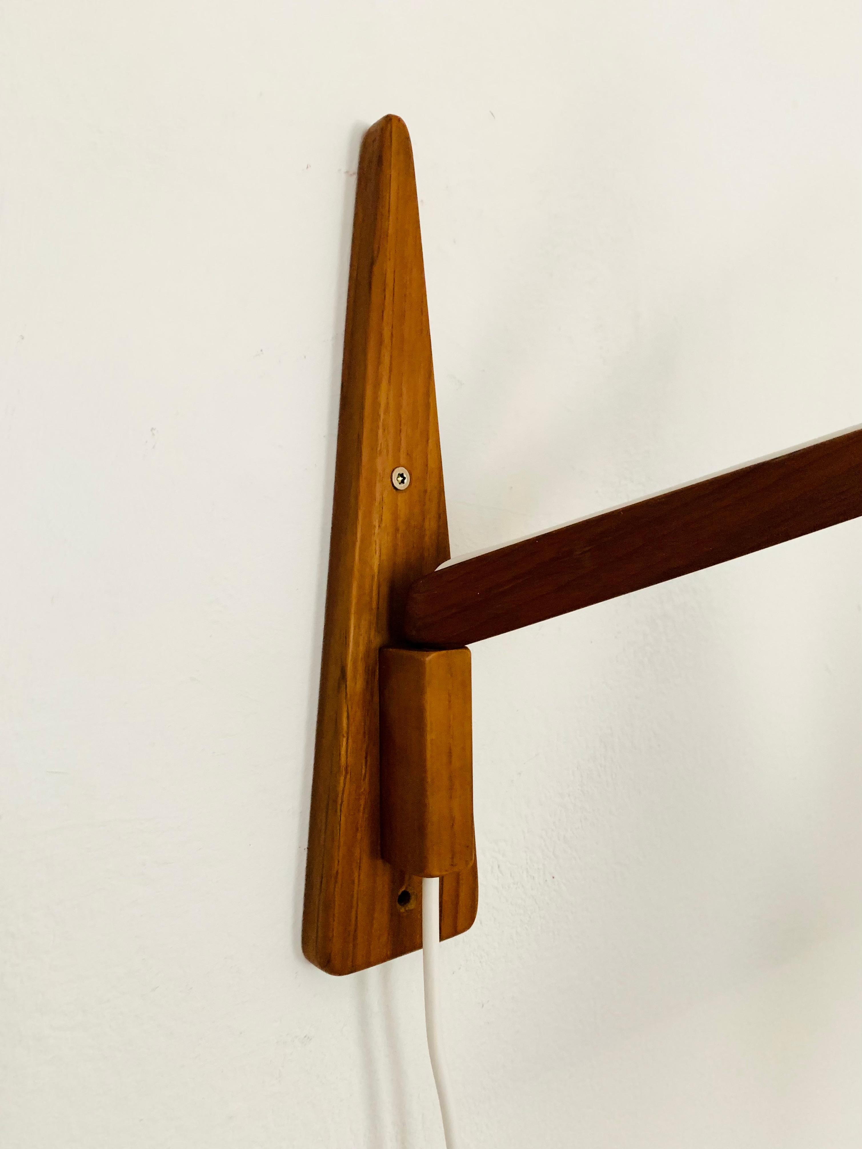 Mid-20th Century Adjustable Teak Wall Lamp by Temde For Sale