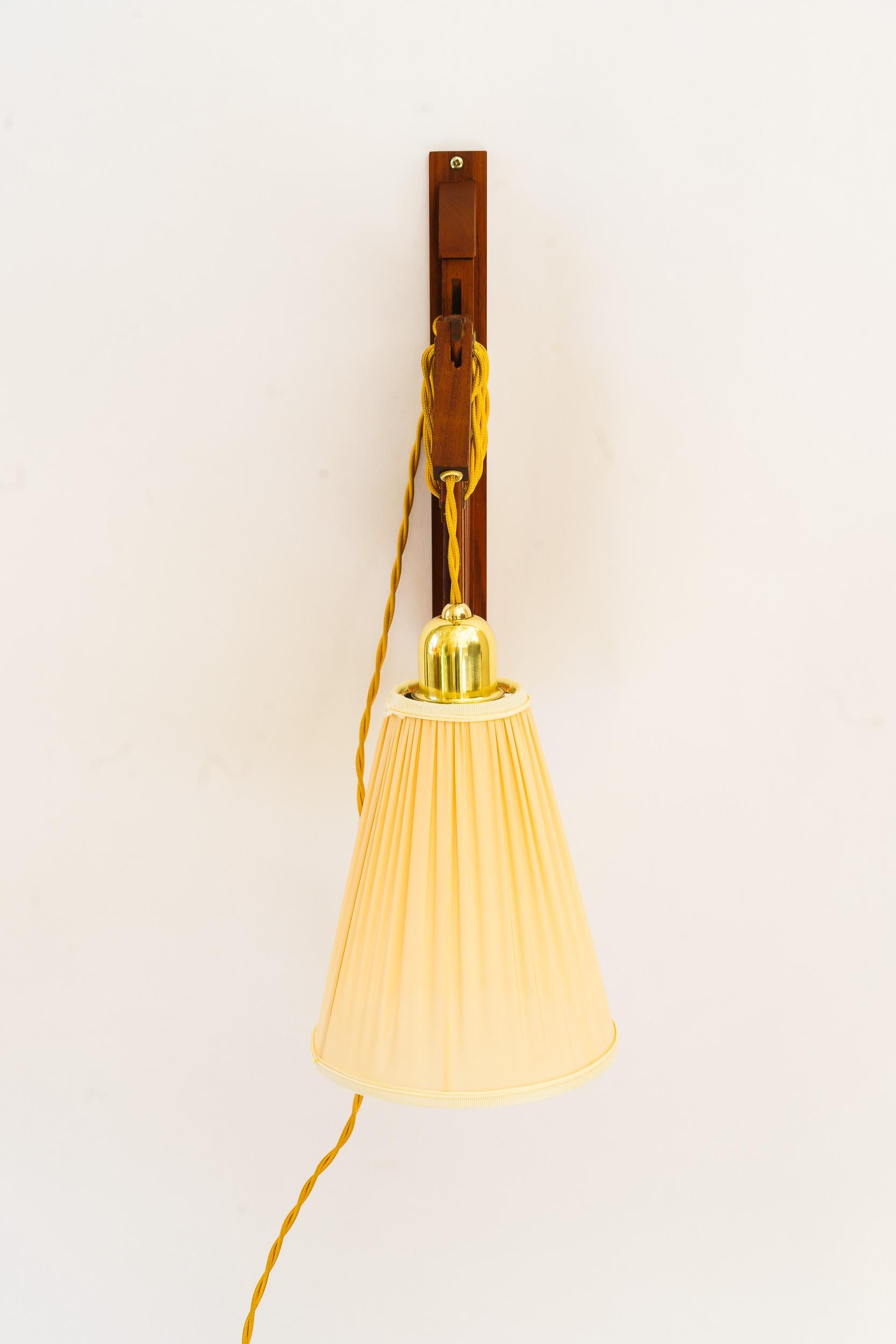 Mid-Century Modern Adjustable teakwood wall lamp with fabric shade denmark around 1960s For Sale