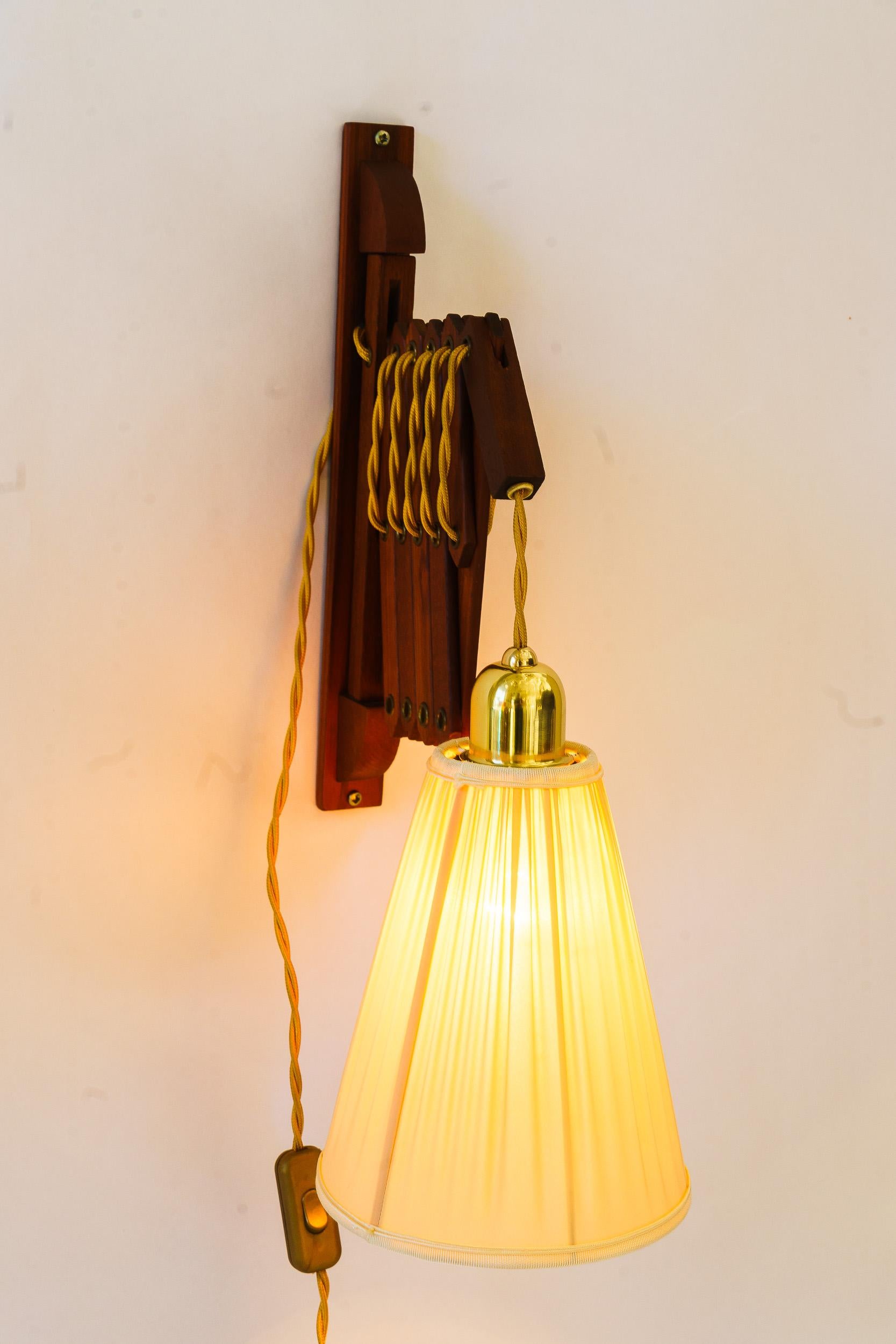 Adjustable teakwood wall lamp with fabric shade denmark around 1960s For Sale 1