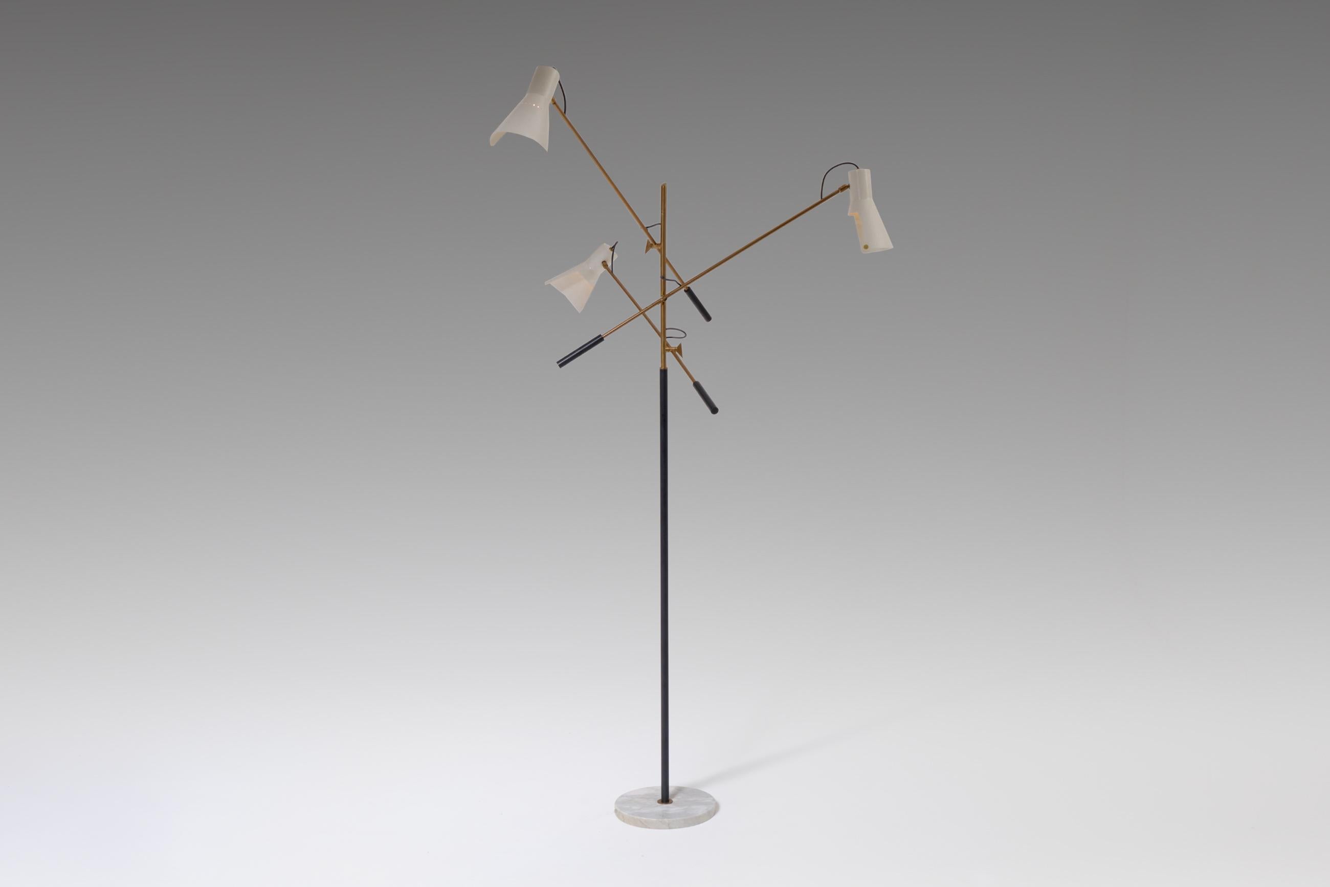 Refined floor lamp produced by Stilnovo, Italy, 1950s. This stunning large floor lamp has three adjustable arms connected to the central brass stem and stands on a round marble base. The lamp is fully adjustable; the arms as well for the ivory