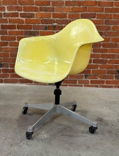Adjustable Translucent Yellow Eames Desk Armchair on a Rolling Base