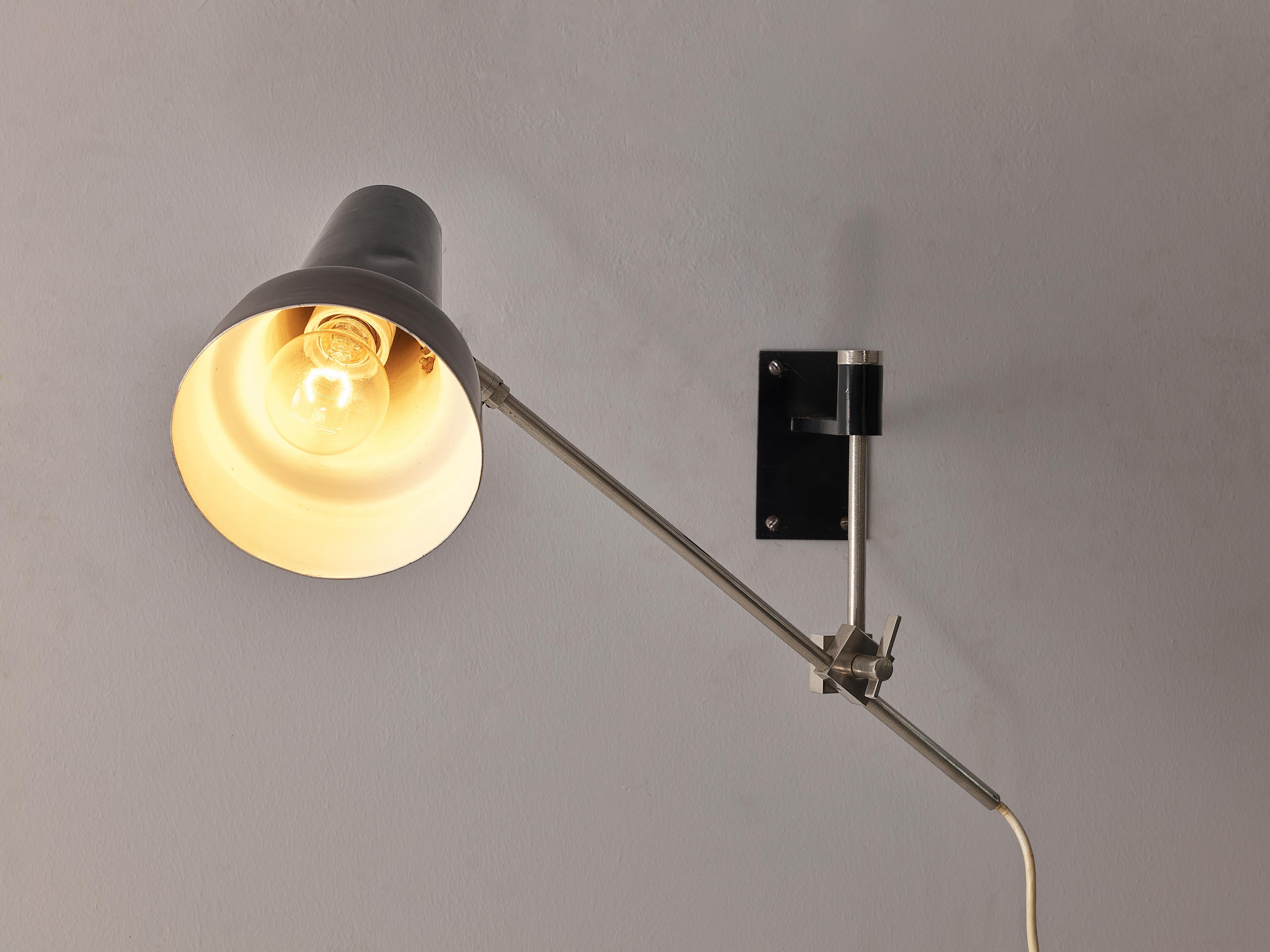 Wall lamp, aluminum, metal, Europe, 1960s

This pragmatic wall lamp can be attached on the wall. Both the stem and the cone shaped lamp shade that surrounds the lightbulb are adjustable, meaning that the light can be directed in any preferred