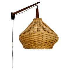 Lampada da parete regolabile in vimini e teak di Kaiser Leuchten