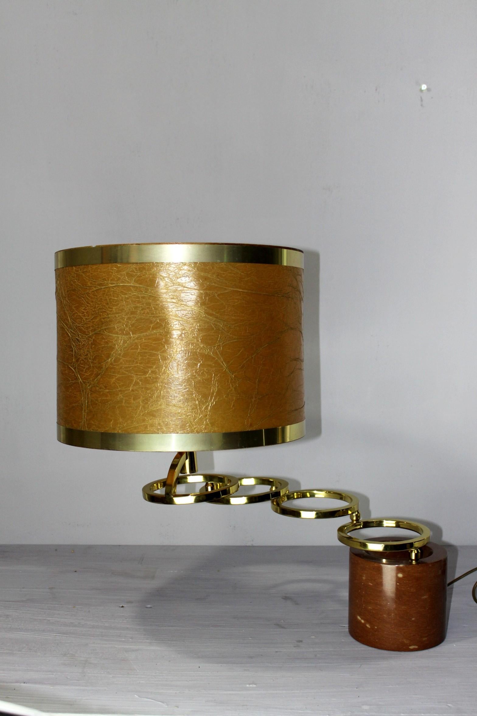 Willy Rizzo adjustable table lamp for BF, Red marble brass, 1970. Rare adjustable table lamp with a heavy foot from red marble of verona and revolvable rings from brass. Original 1970 shade. The condition is very good, the joints are working fine,