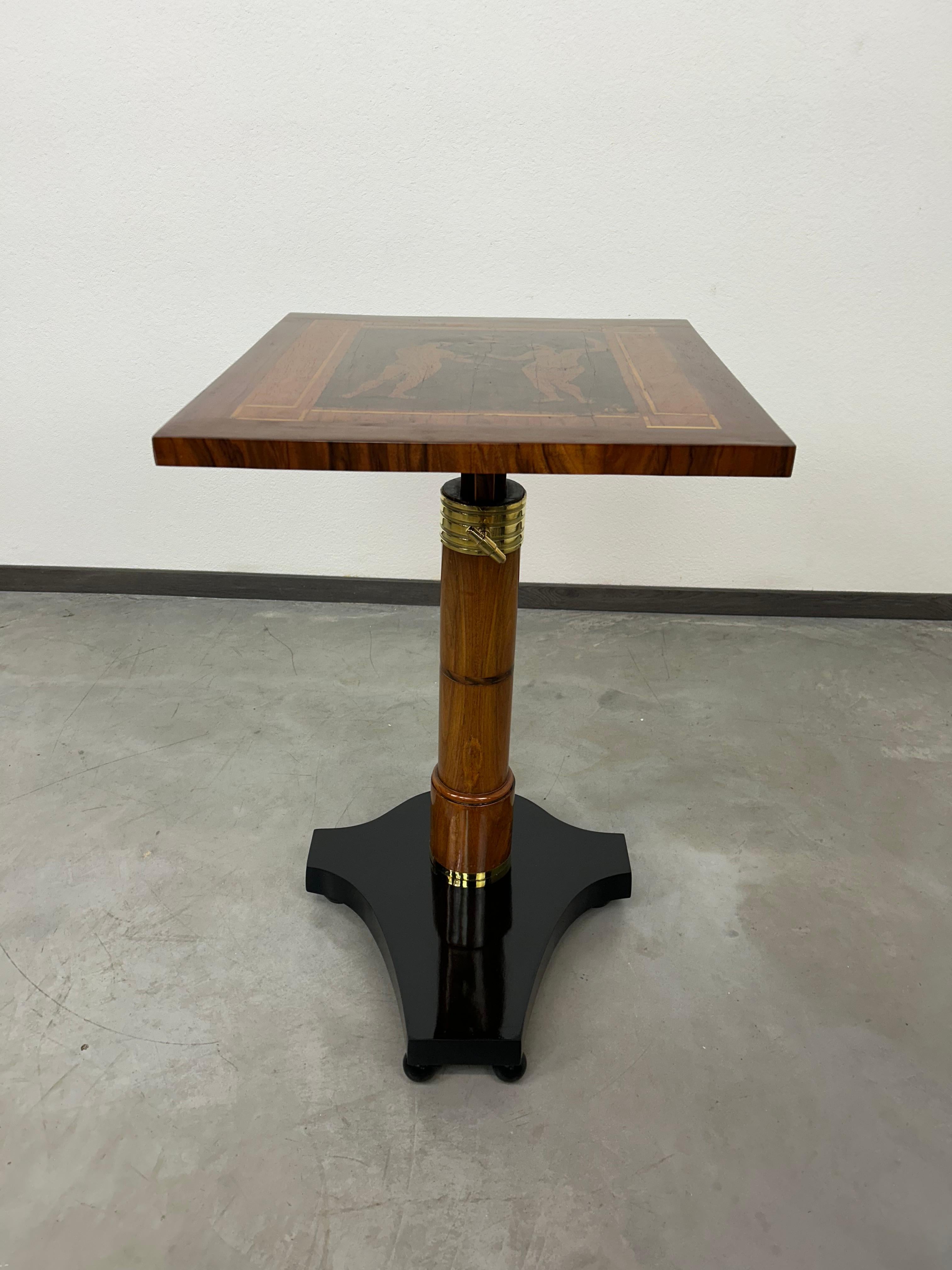 Adjustable writing table with Adam and Eve inlay. Professionally stained and repolished.