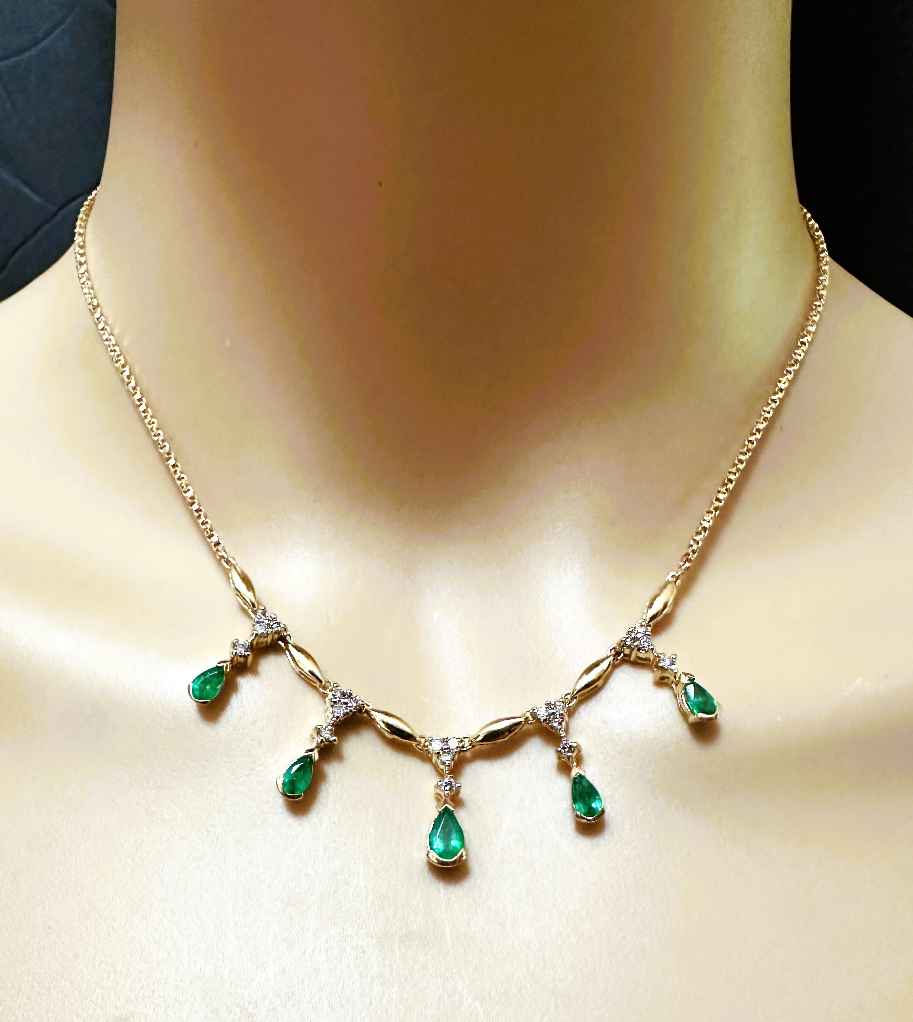 This necklace is just gorgeous.  It is pre-owned but just like new.  It's been very well-cared for.  The emerald and diamond drops float on the beautiful 14k Fancy Cut Chain so they hang beautifully as you move.  It has 5 Pear bezel set emeralds. 
