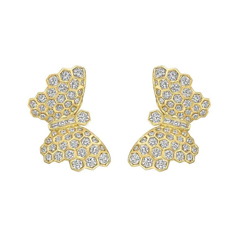 Butterfly earrings, with graduating round brilliant-cut diamond-set wings and round brilliant-cut diamond-set head, with baguette-cut diamond-set body, mounted in 18k yellow gold, signed Adler.

Diamonds weighing approximately 3.38 total carats
Clip