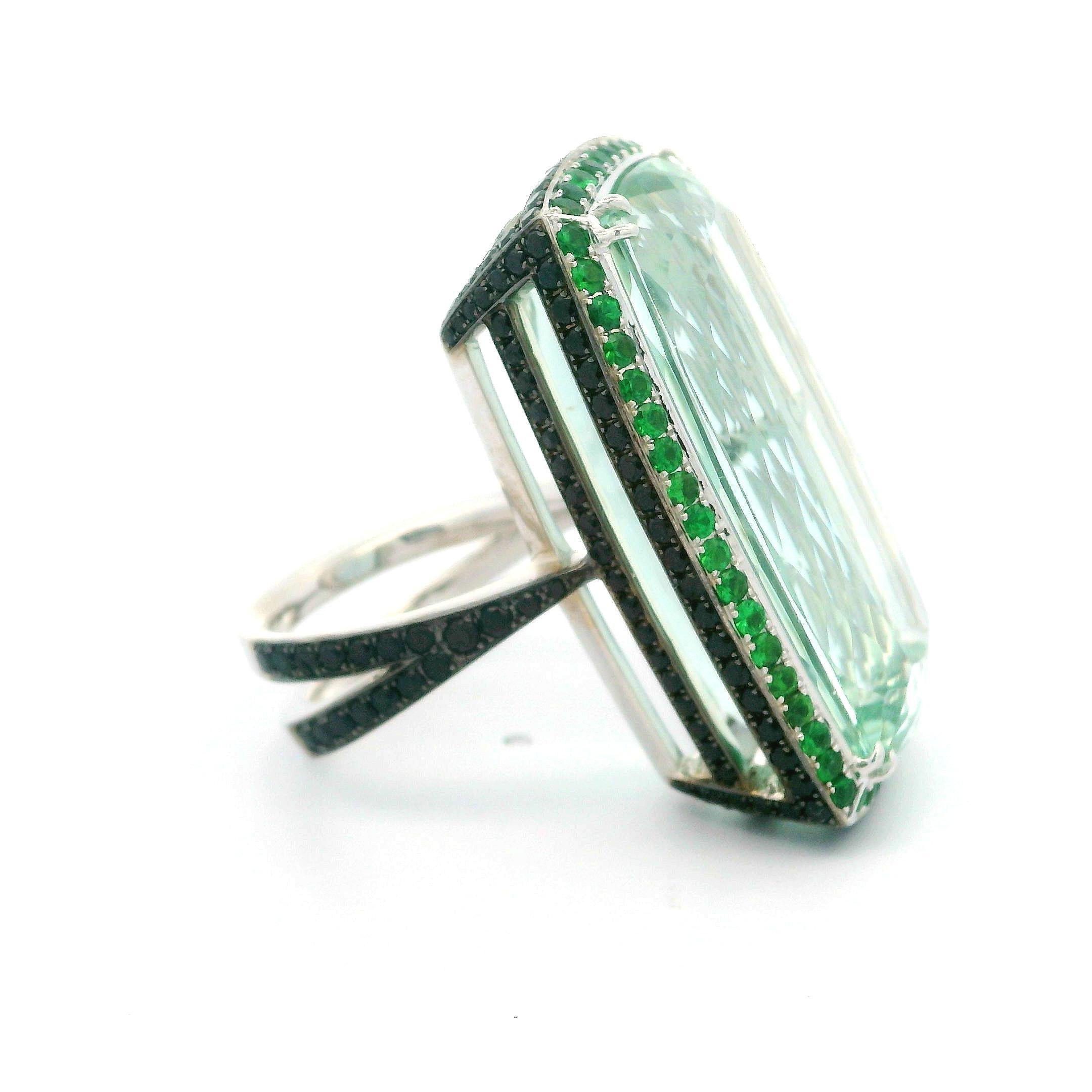 --Stones:--
1 Natural Genuine Beryl - Long Cushion Cut - Dual Prong Set - Green Color - 30.45x17.69x11.81mm - 44.88ct exact. certified ** See Certification Details Below for Complete Info **
200 Black Stones - Faceted Round Brilliant Cut - Pave Set