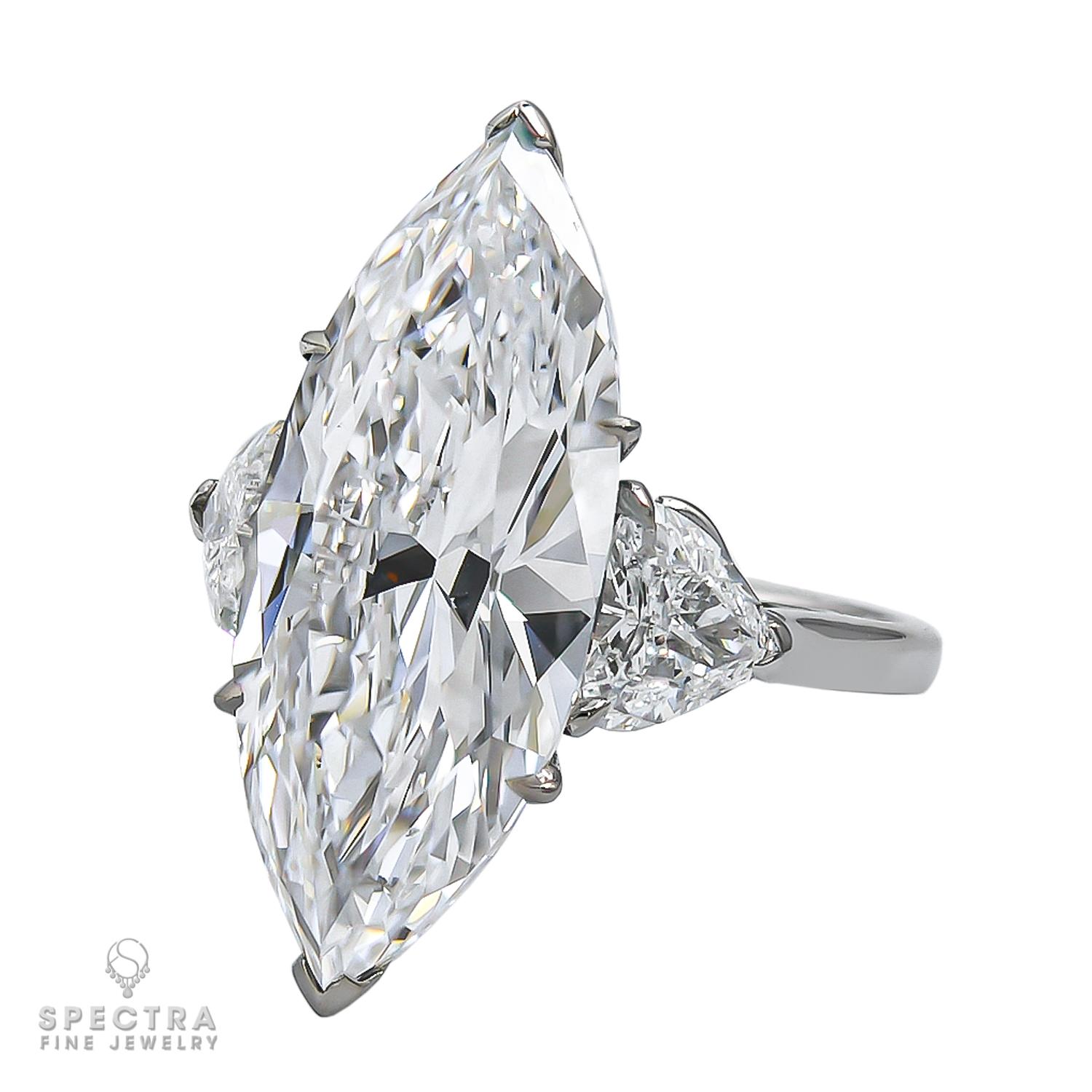 This Signed Adler Marquise Diamond Engagement Ring, made in England in the 21st century, circa 2000s, is crafted in 18K white gold and features a marquise shape diamond with an estimated weight of 10.04 carats. Adler is a noted fine jewelry house