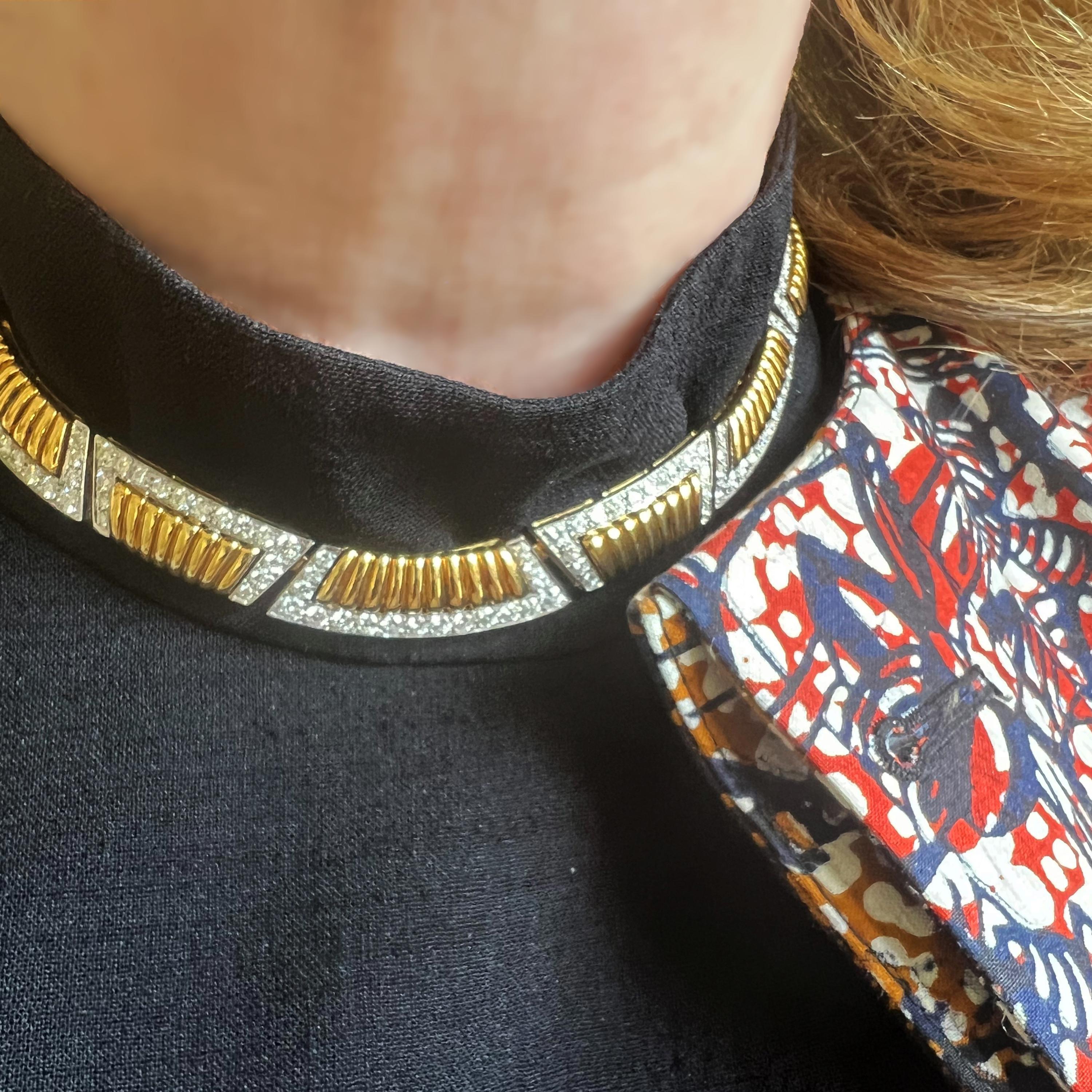 An Adler diamond and gold necklace, with yellow gold, alternating, curved trapezoid shaped, ribbed links, with alternating outer and inner edges set with round brilliant-cut diamonds, in white gold grain settings, mounted in 18ct gold, signed