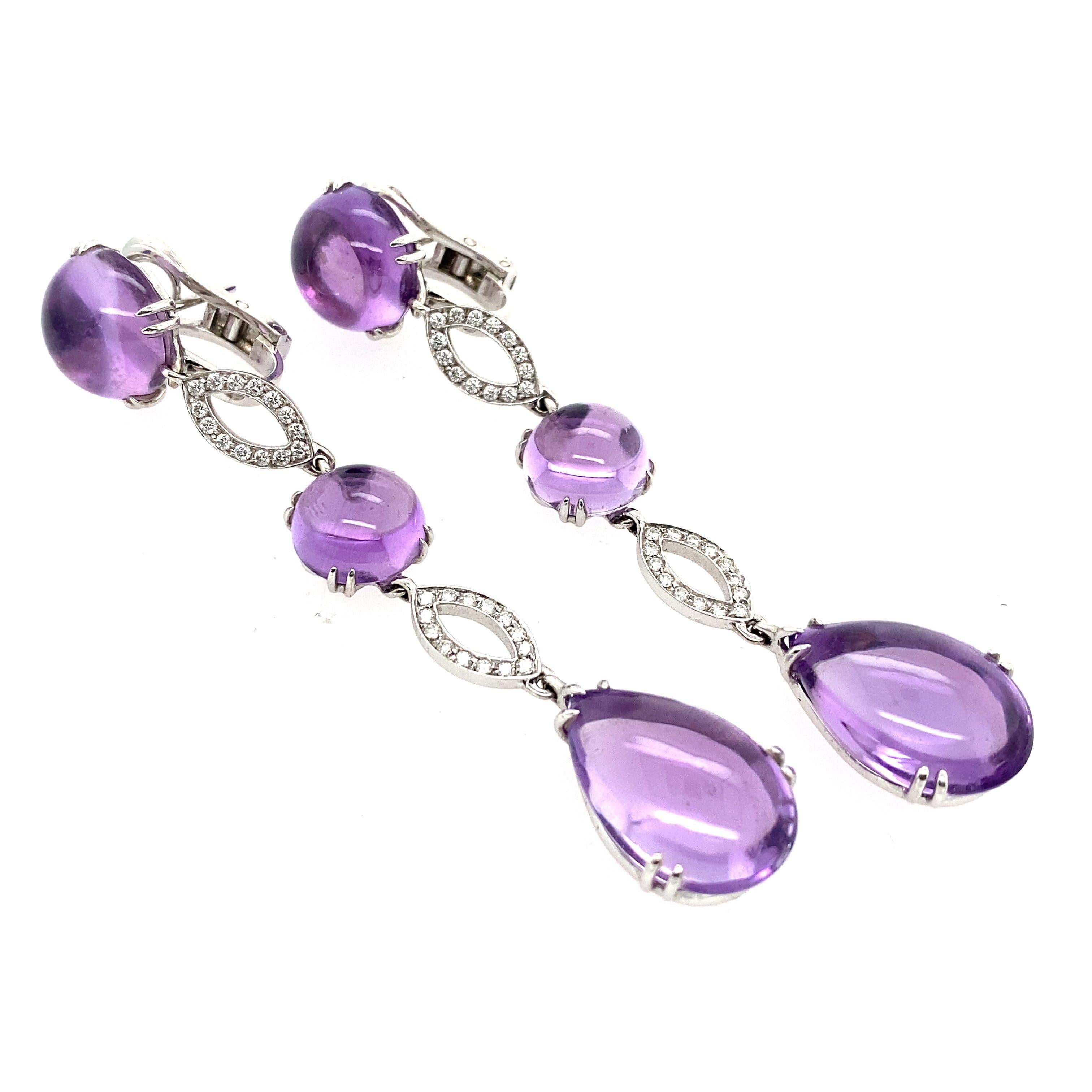 The design of these earrings is inspired by the raindrops on a rainy day. The amethyst is a symbol of peace, protection, and passion.  These drop earrings are a statement piece and will go with any outfit.
Total Diamond Weight: 0.50ct 
Diamond