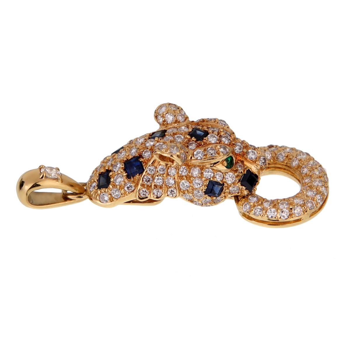 A chic diamond panther pendant by Adler showcasing round brilliant cut diamonds, square sapphires, and emerald eyes in 18k yellow gold.

The pendant measures .53
